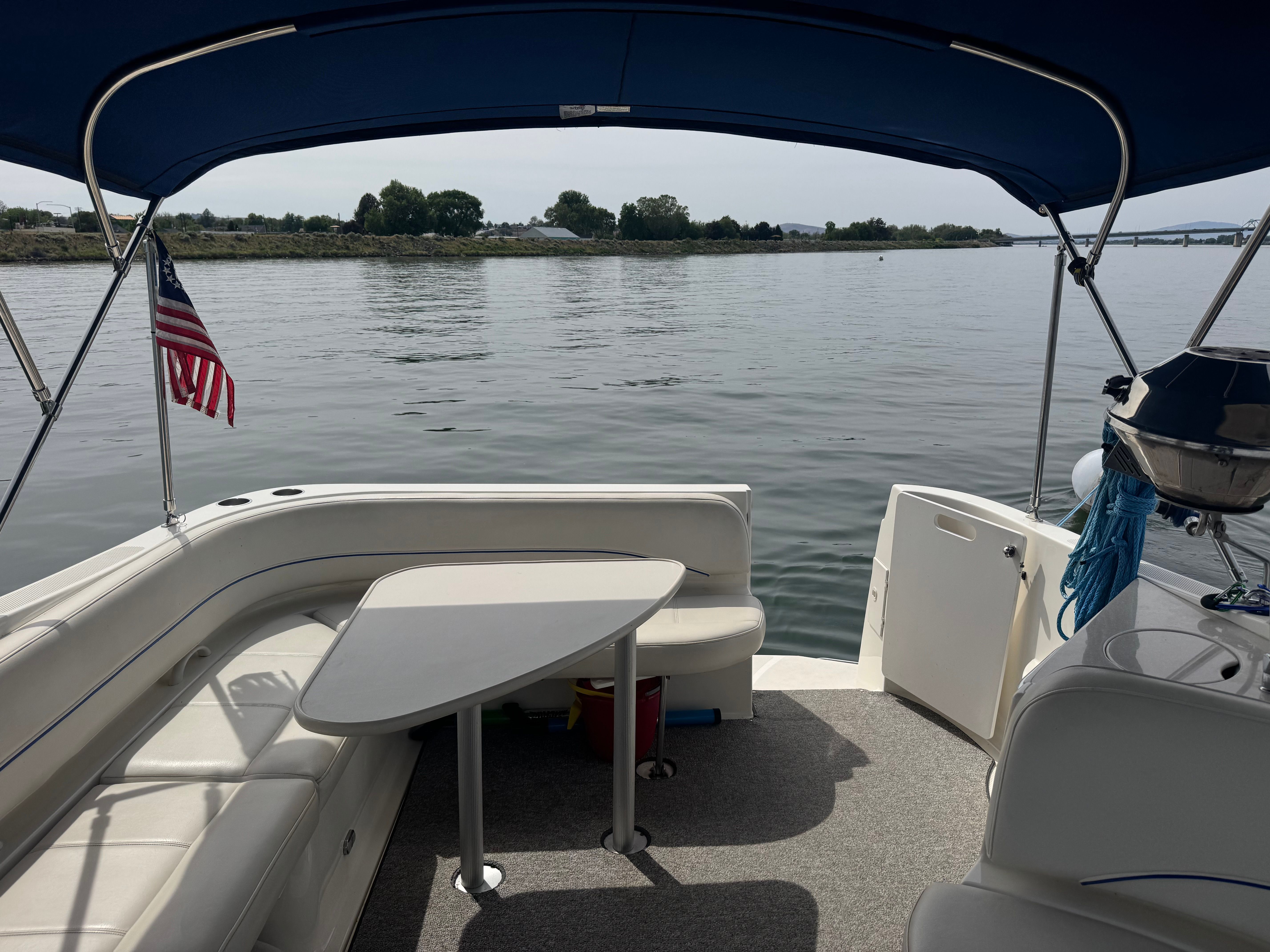 Interior view of a 2008 Bayliner 340 yacht with table and seating area.