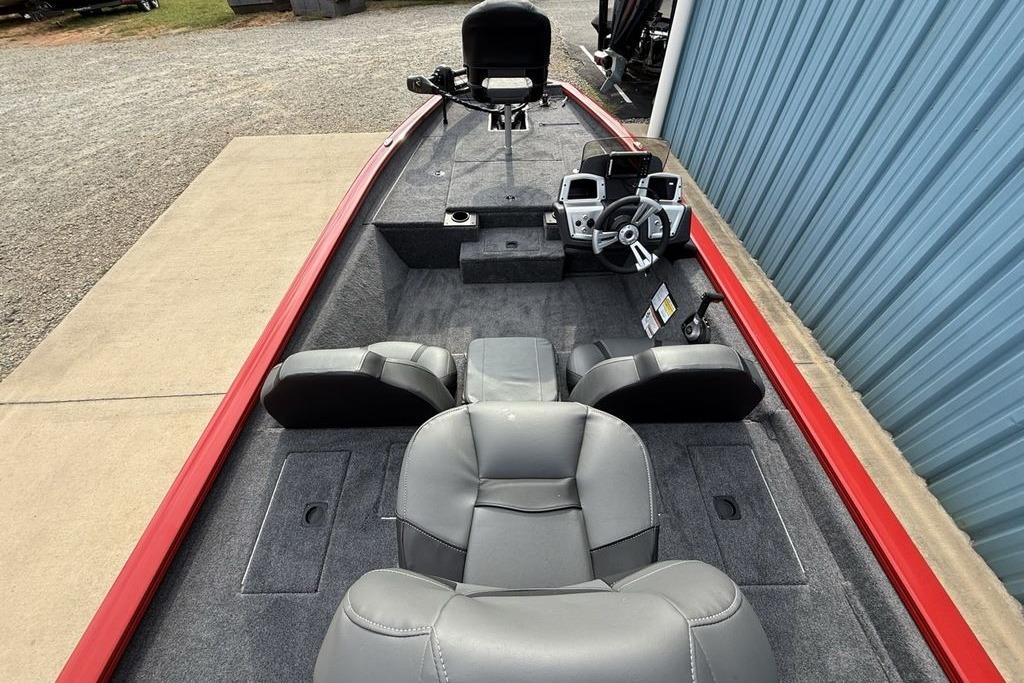 2026 Tracker Pro Team 175 boat interior with gray seating and steering console.