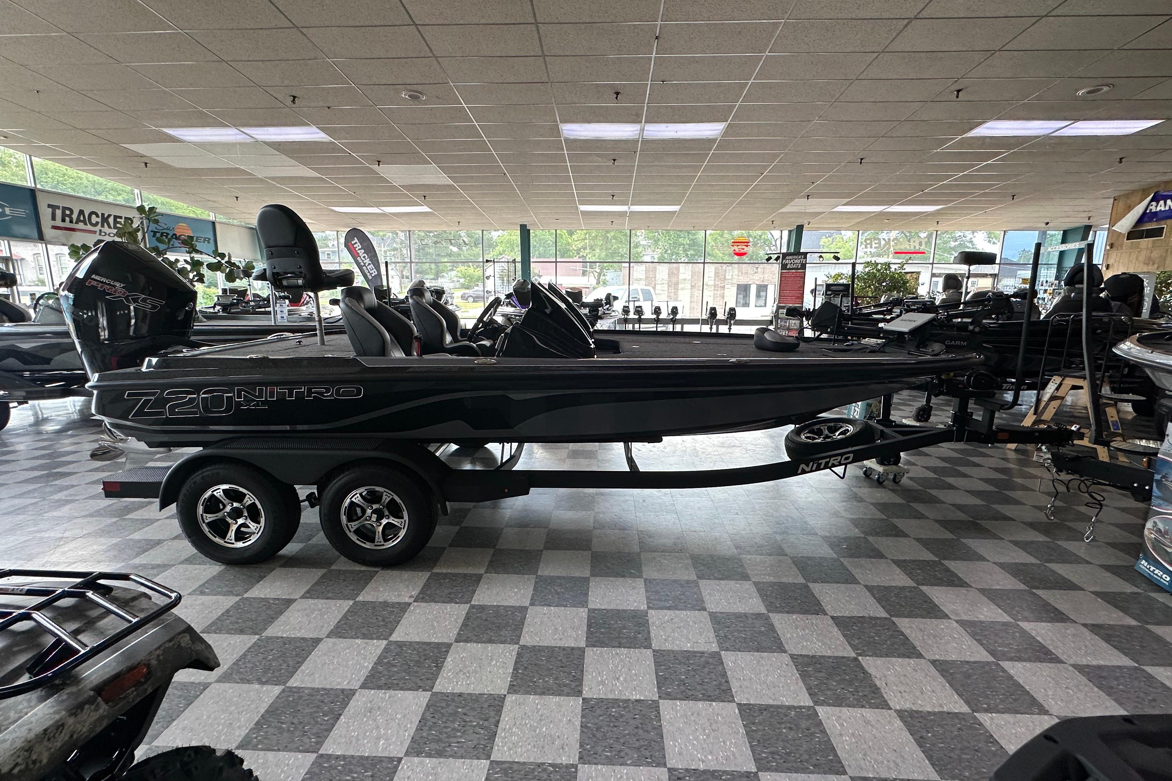 2025 Nitro Z20 XL Pro boat displayed in showroom with checkered floor.