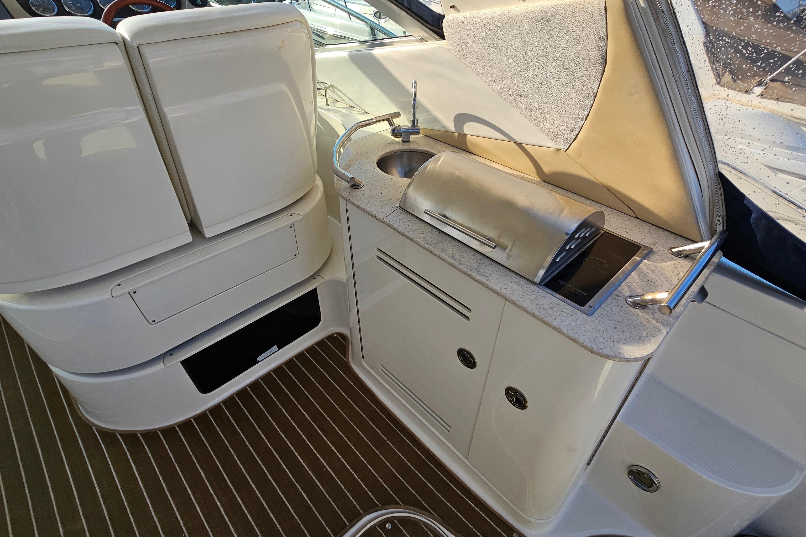 2008 Sea Ray Sundancer 350 yacht interior with kitchenette and grill.