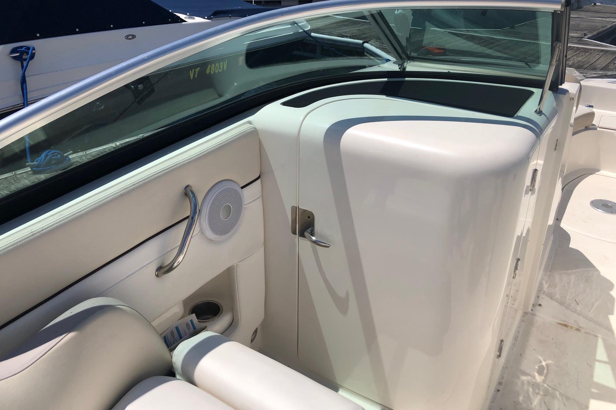 2013 Sea Ray 260 Sundeck interior with white seating and speaker detail.
