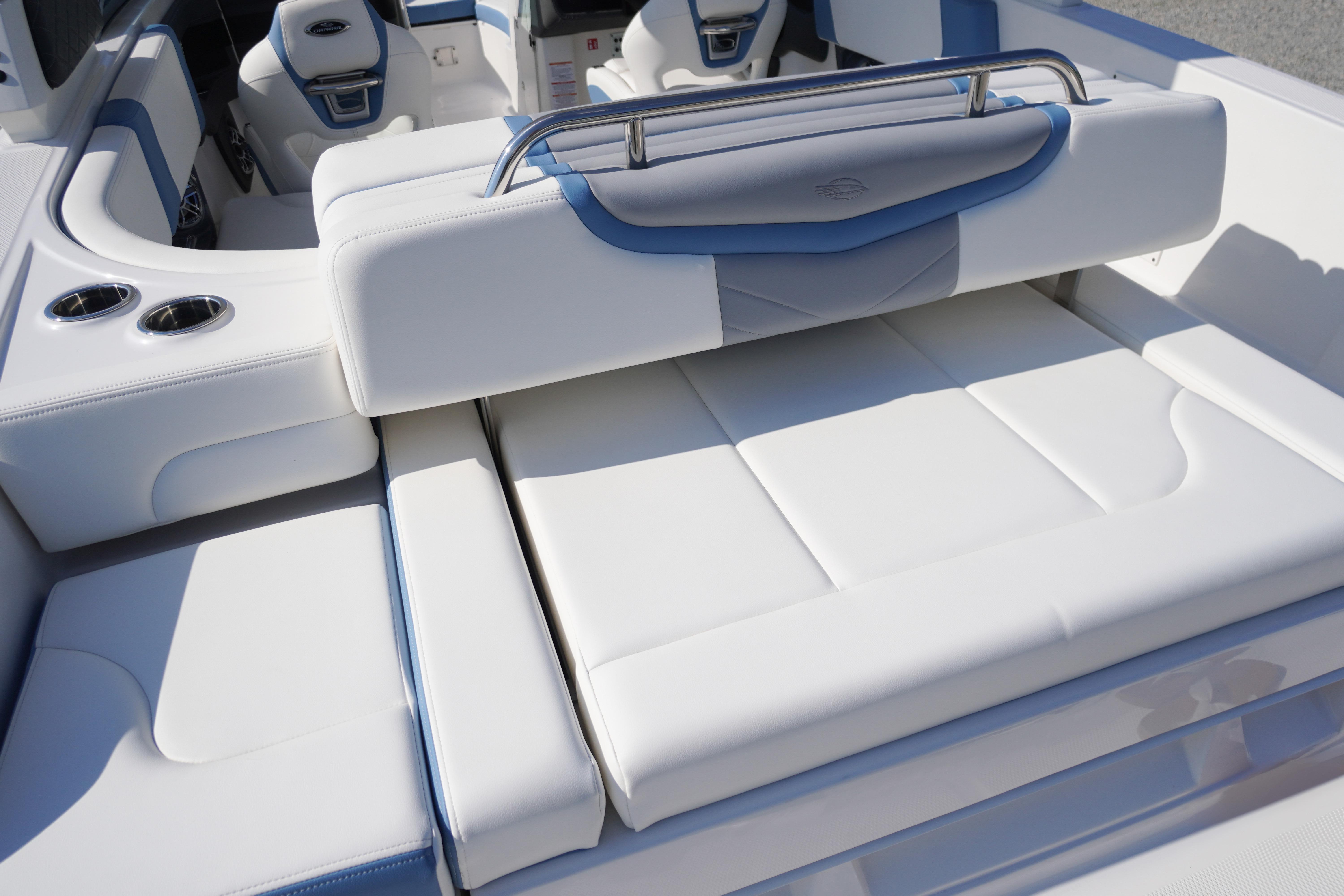 2026 Chaparral 270 OSX boat interior with luxurious white seating and cup holders.