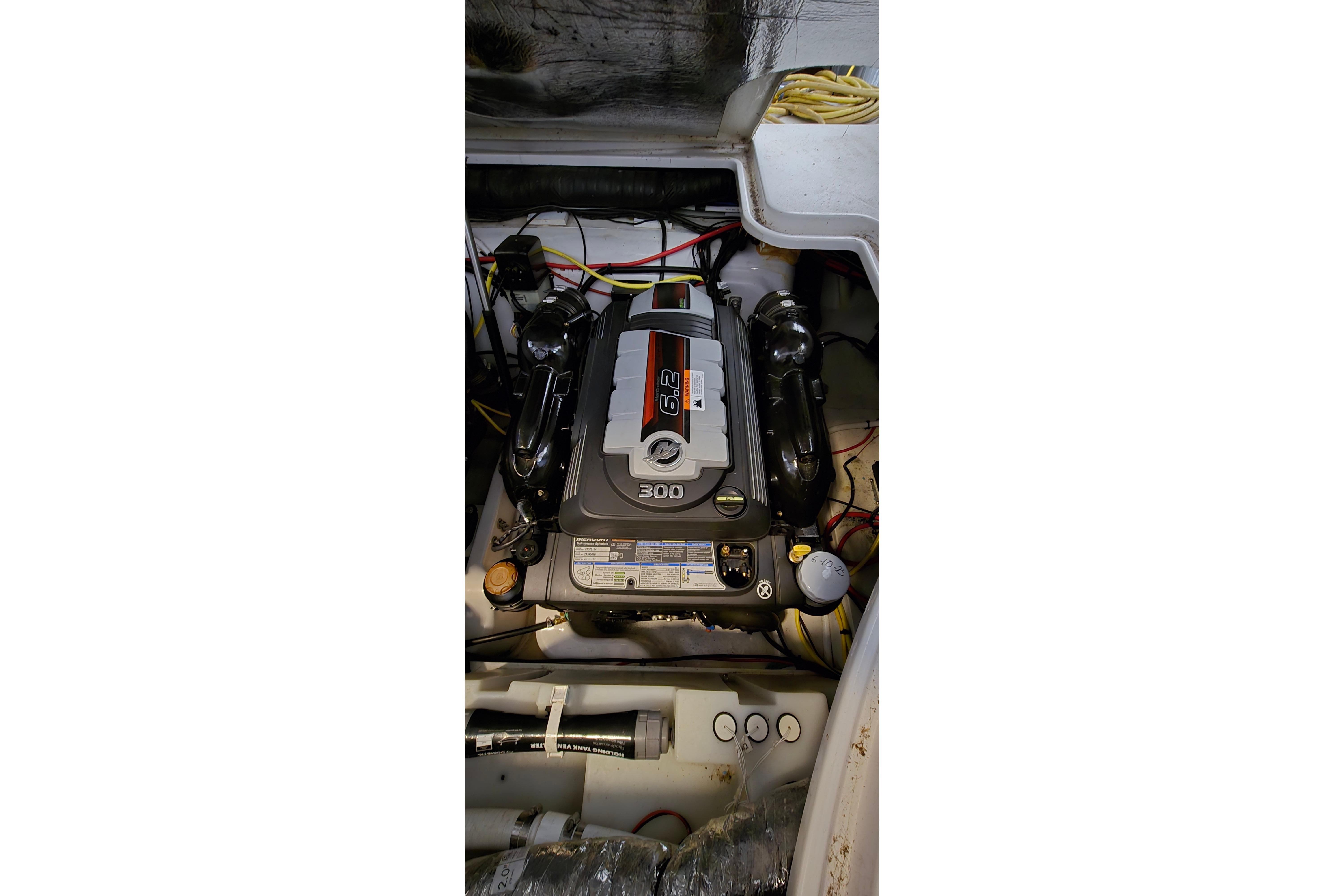 Engine compartment of a 2018 Four Winns V355 boat, showcasing a 300 horsepower engine.
