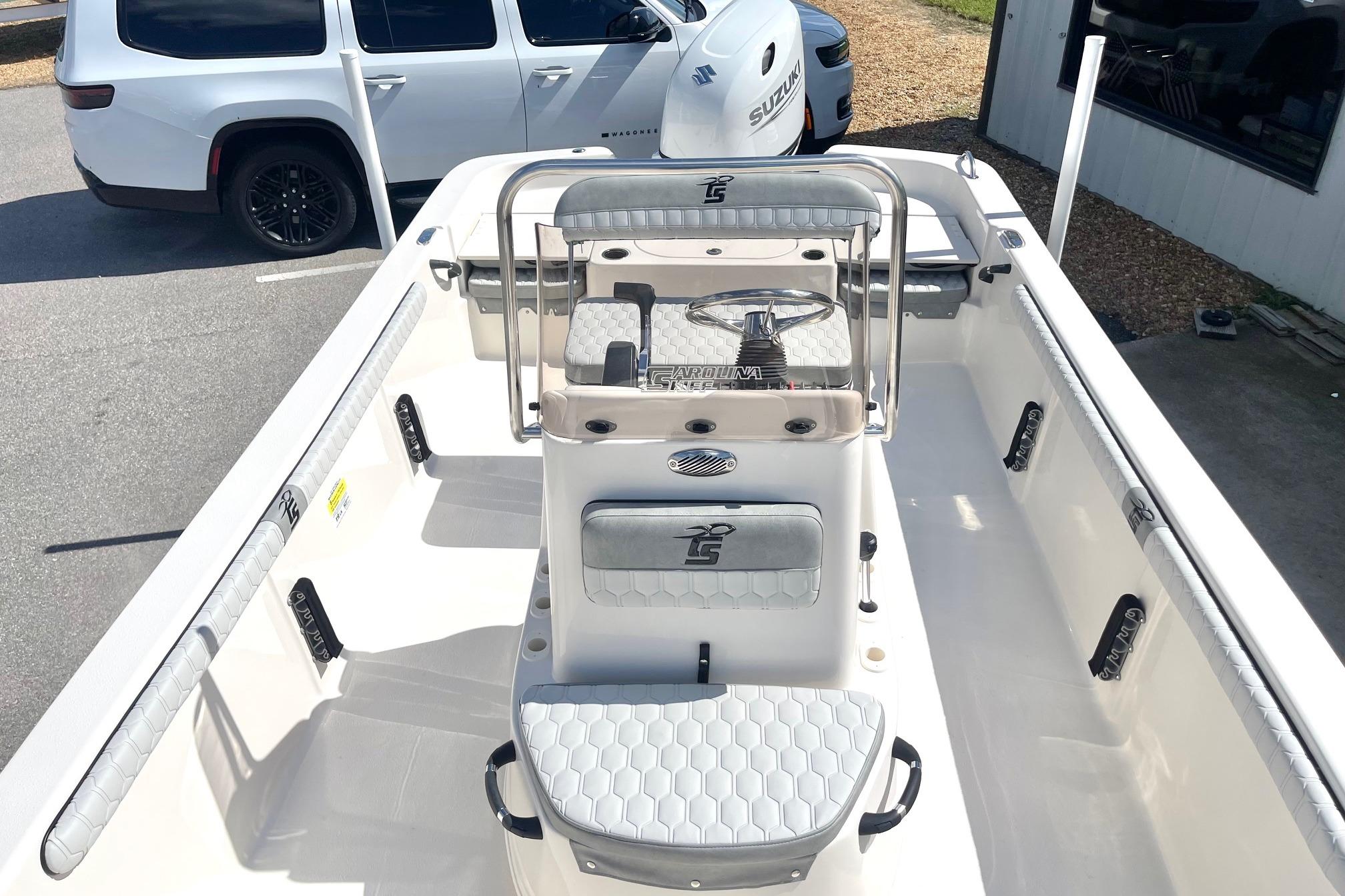 2026 Carolina Skiff 19 LS boat interior with seating and steering console.
