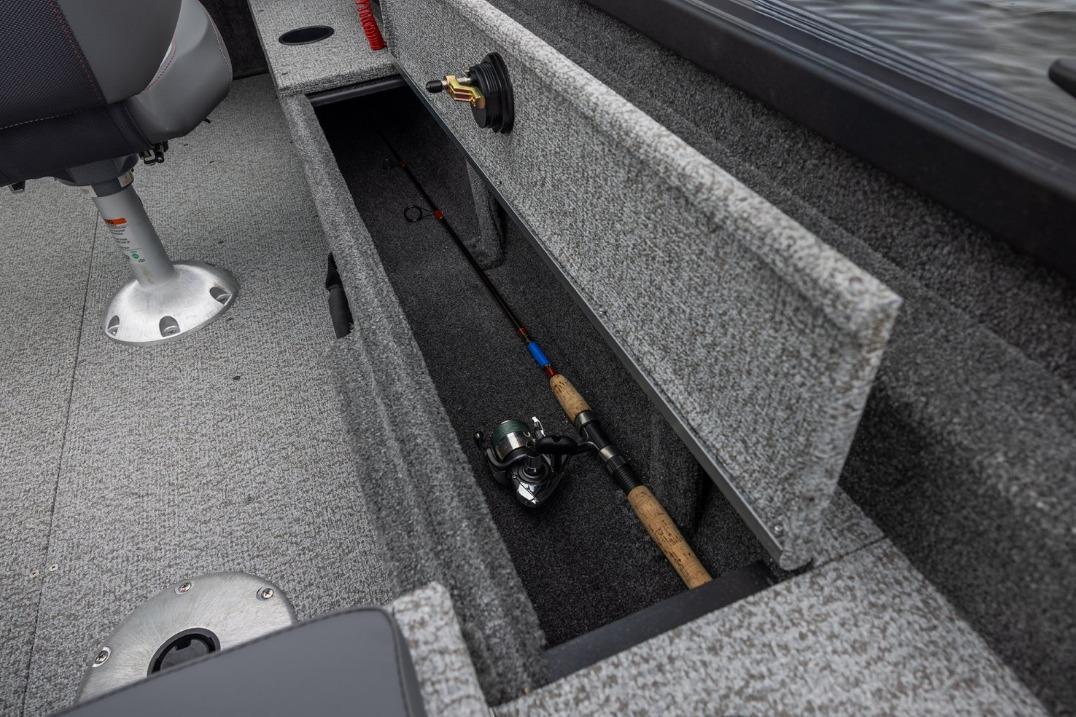 2026 Alumacraft Classic 165 Tiller boat interior with fishing rod storage compartment.