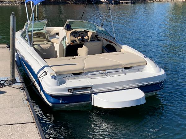 2000 Sea Ray 210 Bow Rider docked on calm water.