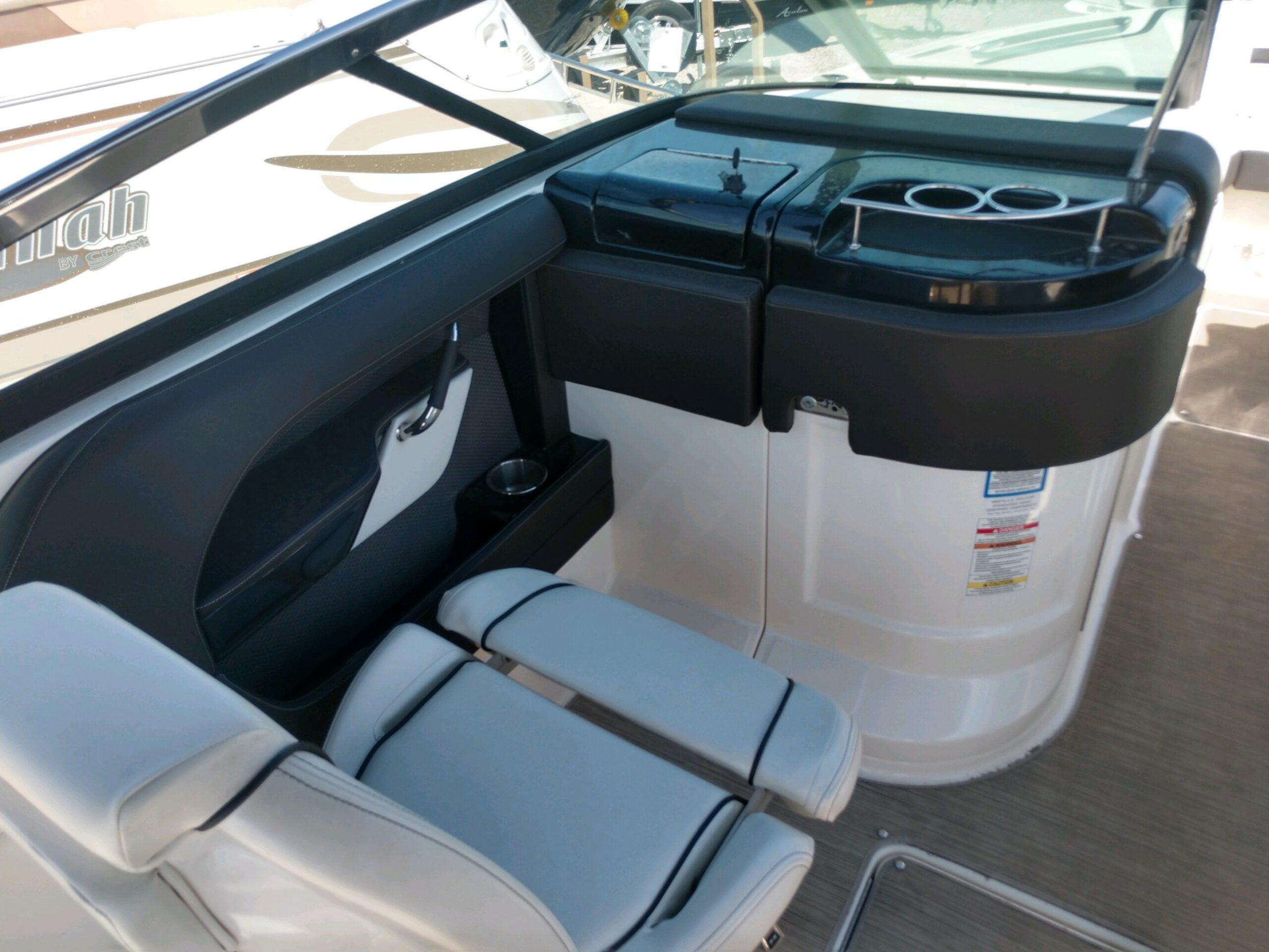 2018 Sea Ray SLX 280 boat interior with seating and cup holders.