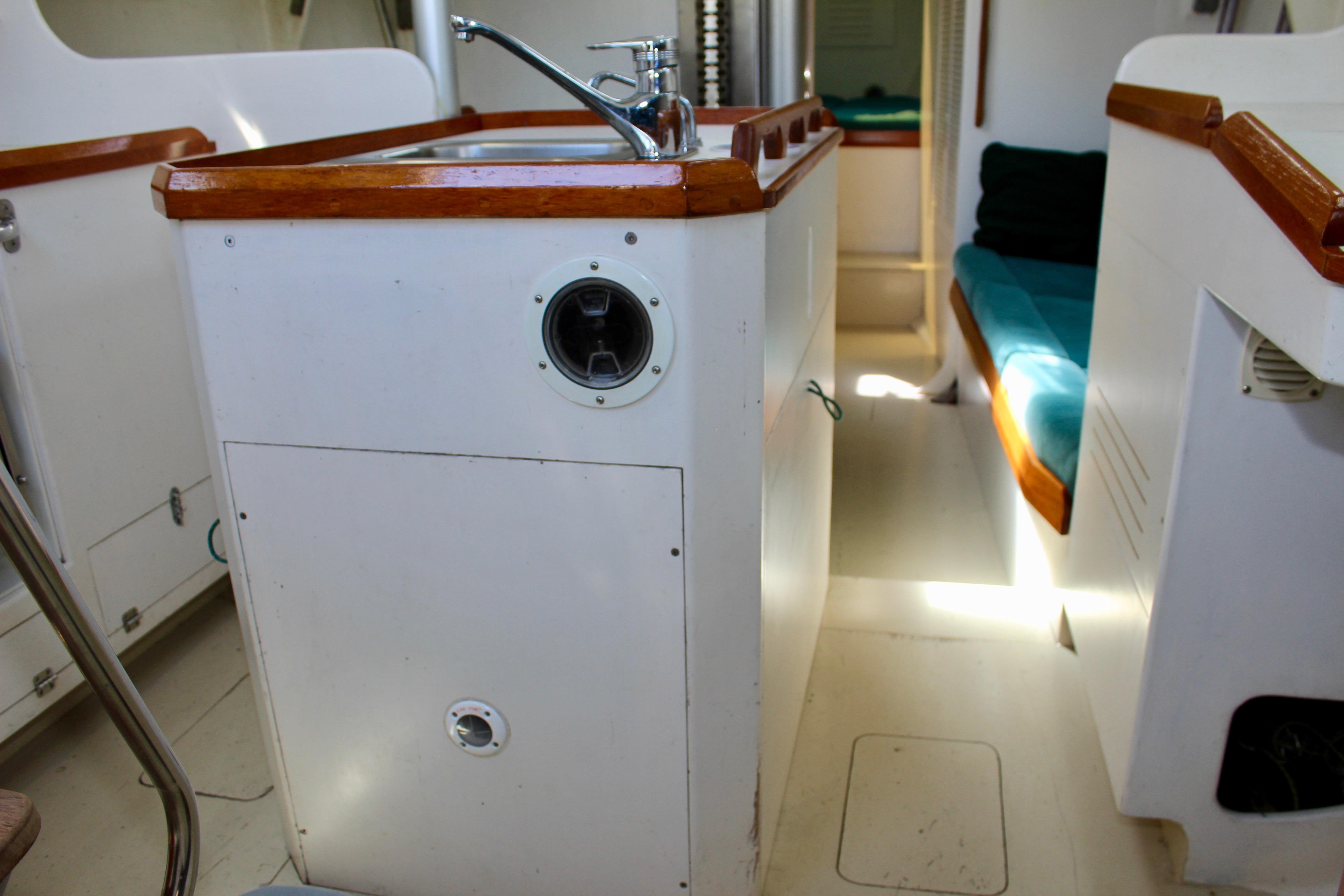 Interior of a 1993 Freya 39 sailboat featuring a compact kitchen area.