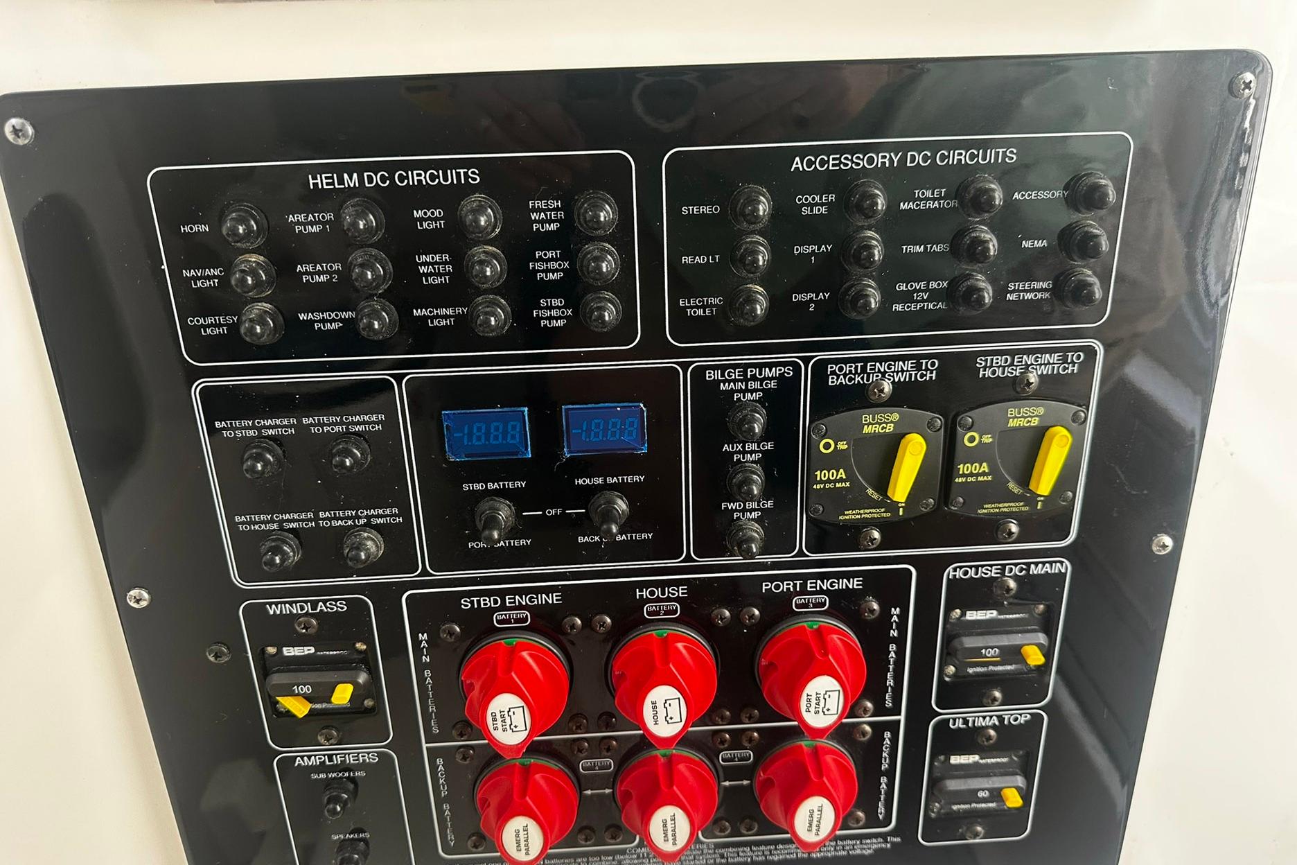 Control panel of a 2002 Sea Fox 228 Commander boat with various circuit switches.