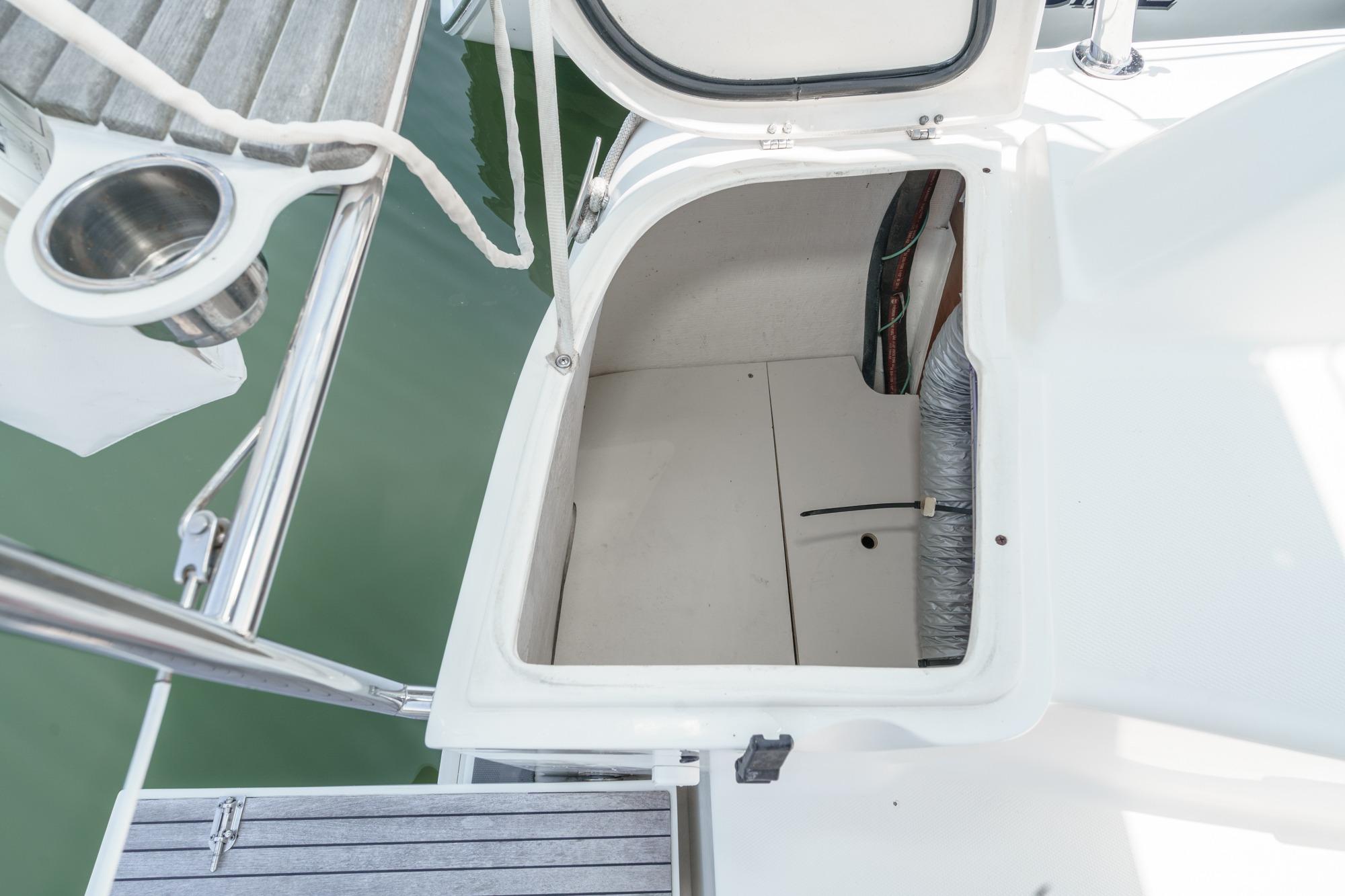 Open storage compartment on a 2015 Hunter 33 sailboat deck.