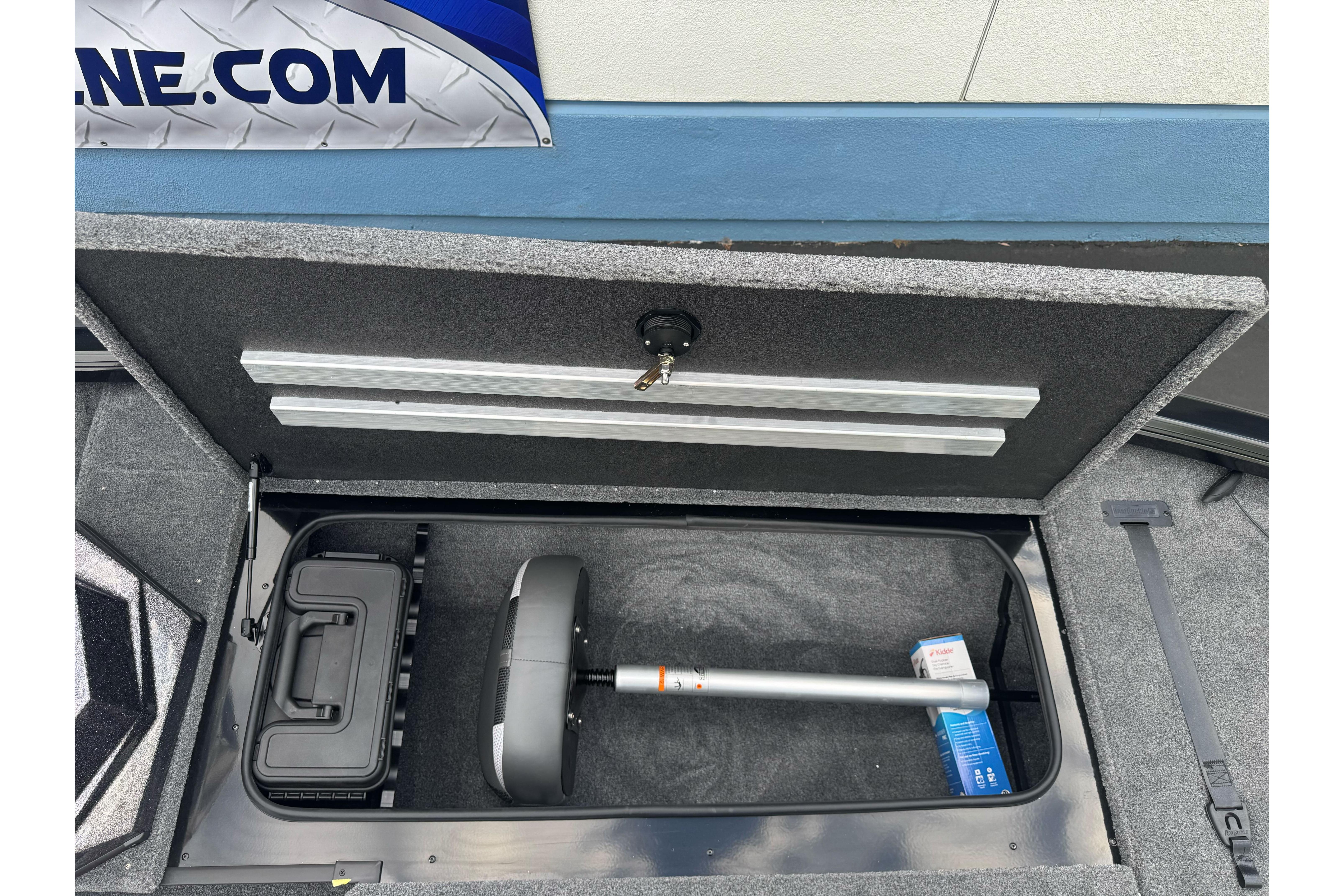 Storage compartment of 2026 Ranger ALPHA 208 boat, featuring organized equipment and accessories.