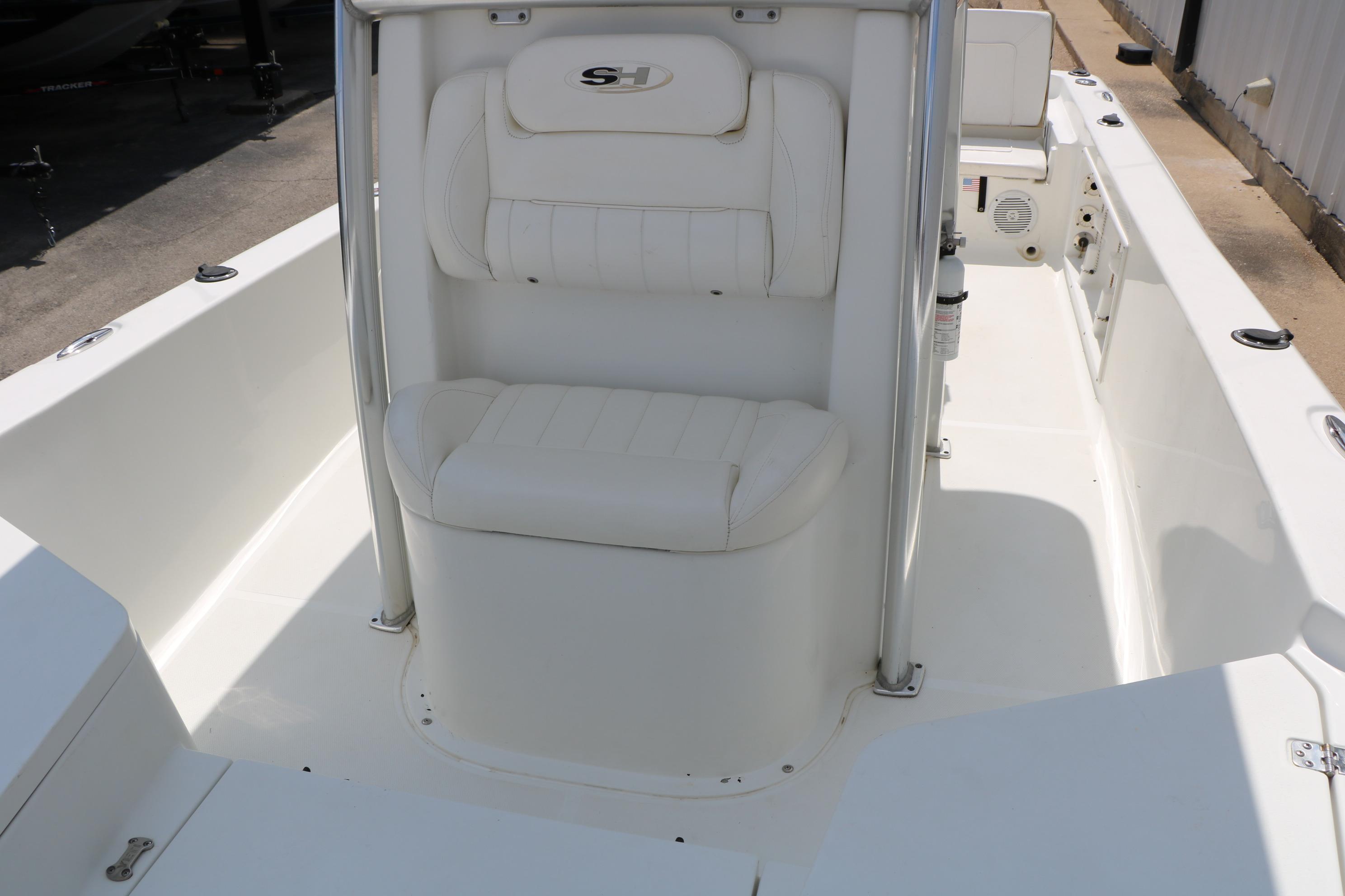 2015 Sea Hunt BX 22 BR boat interior with white seating and console.