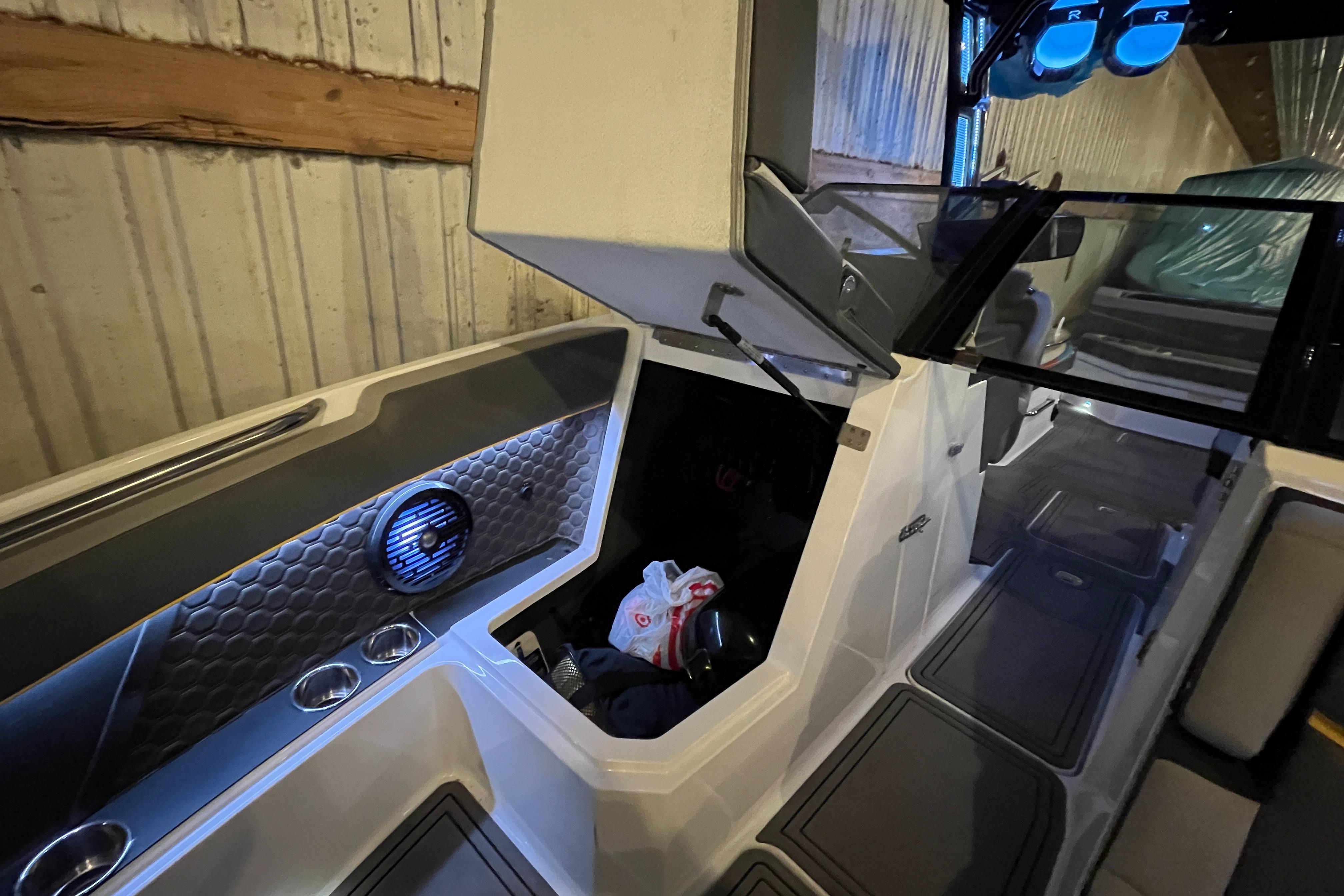 2021 Cobalt R8 Surf boat interior with storage compartment and modern design.