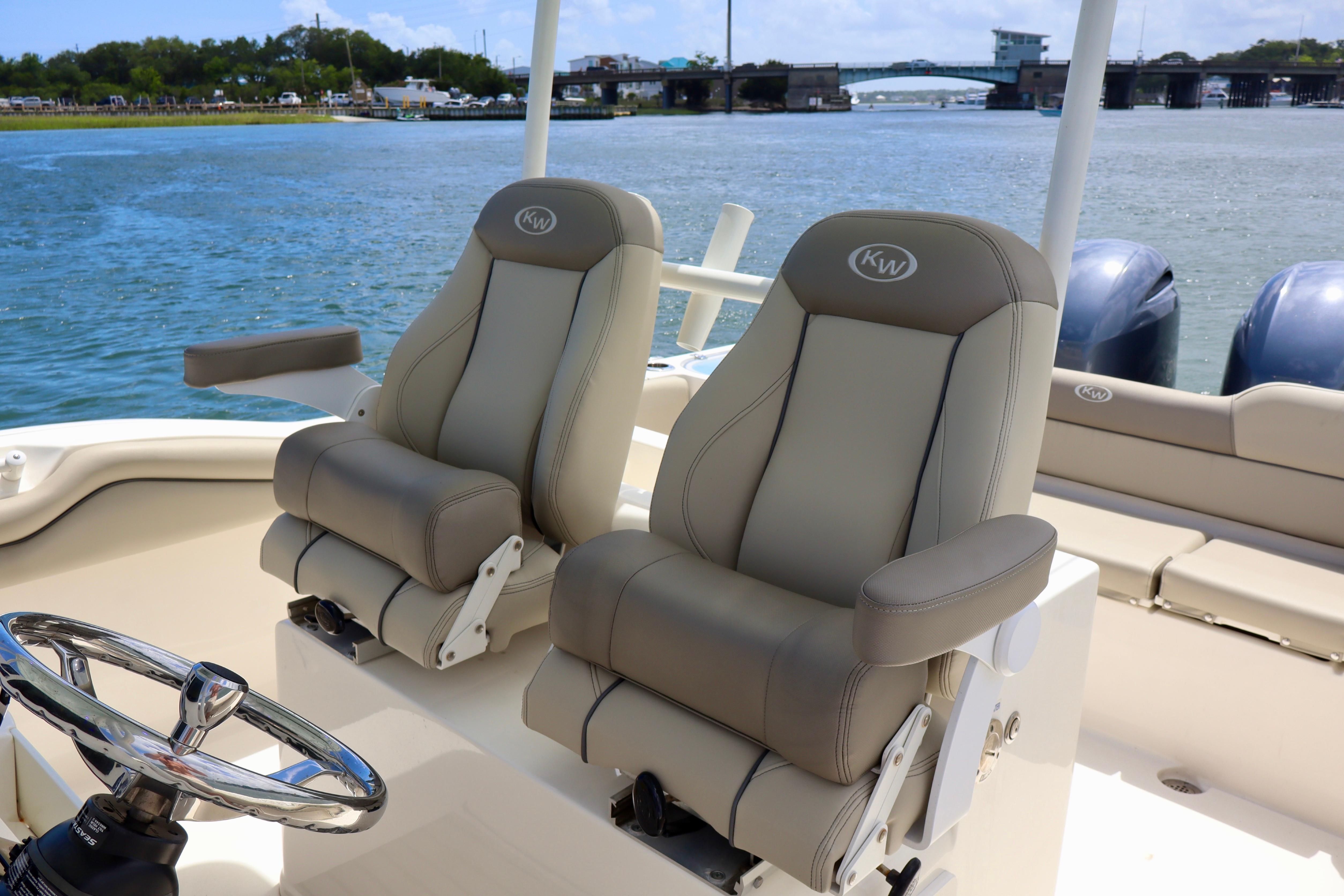 2023 Key West 263 FS boat interior with dual captain's chairs and steering wheel.