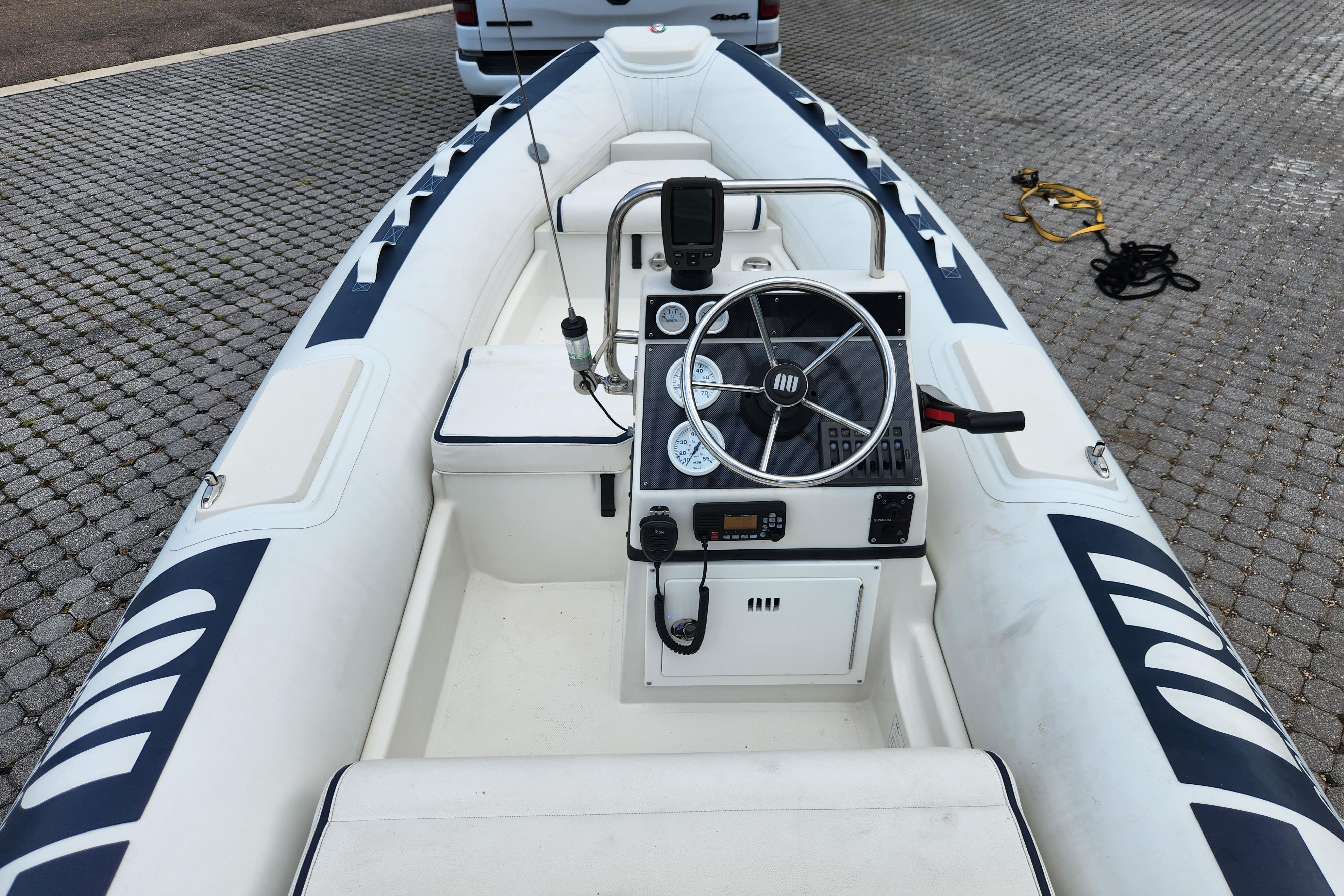 2019 Novurania DL 400 boat interior with steering wheel and control panel.