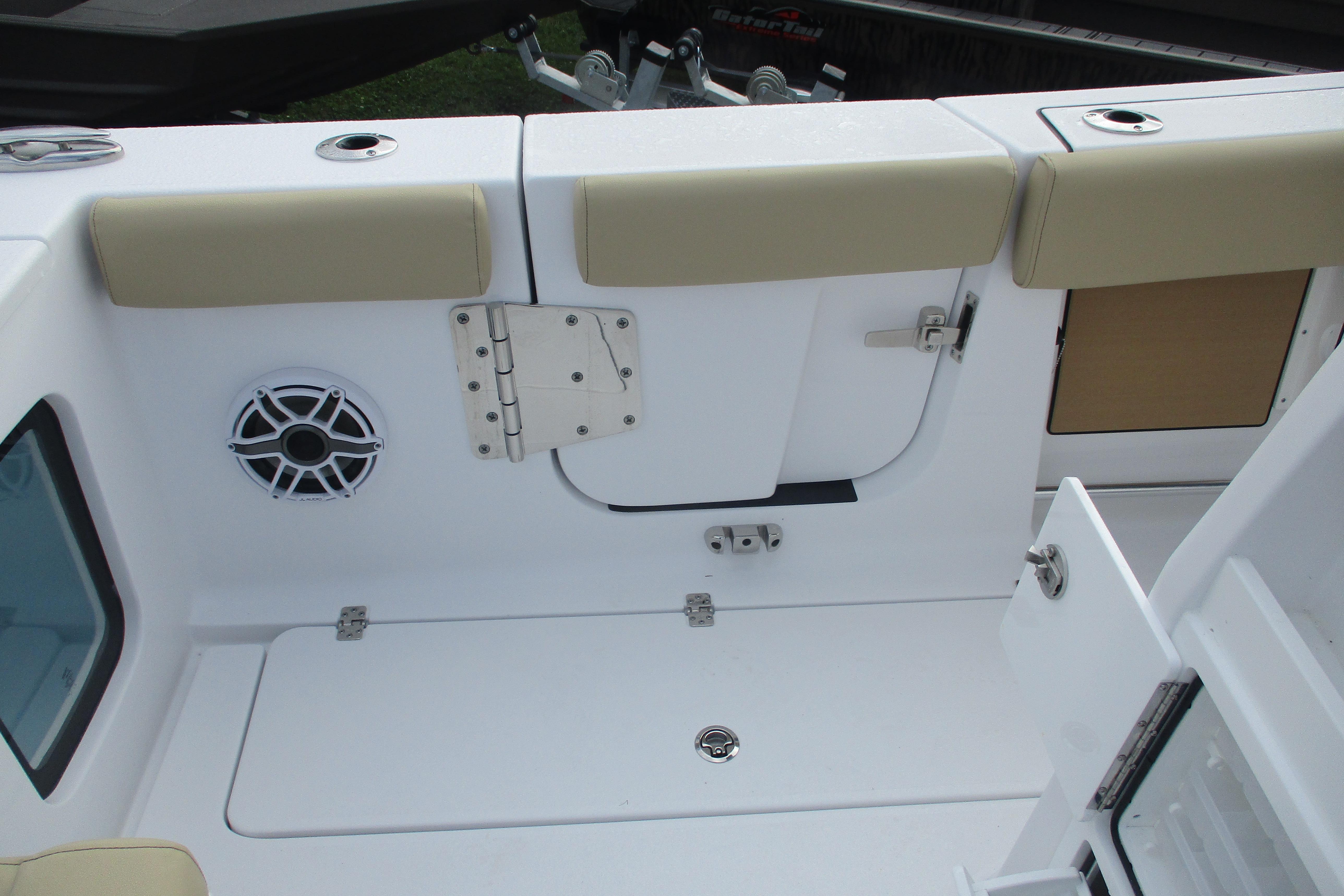 2026 Sportsman Open 302 Center Console boat interior with seating and speaker.