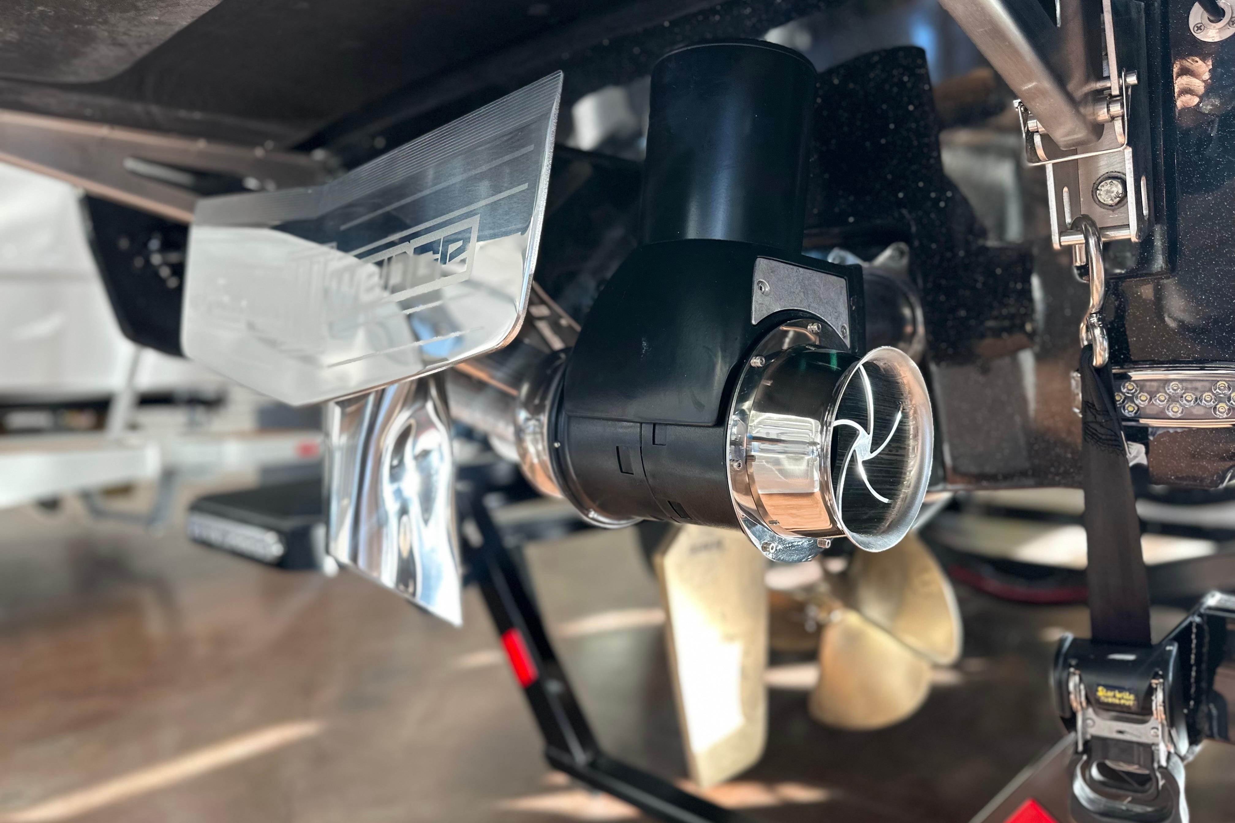 Close-up of 2026 Malibu Wakesetter 25 LSV boat propeller and exhaust system.