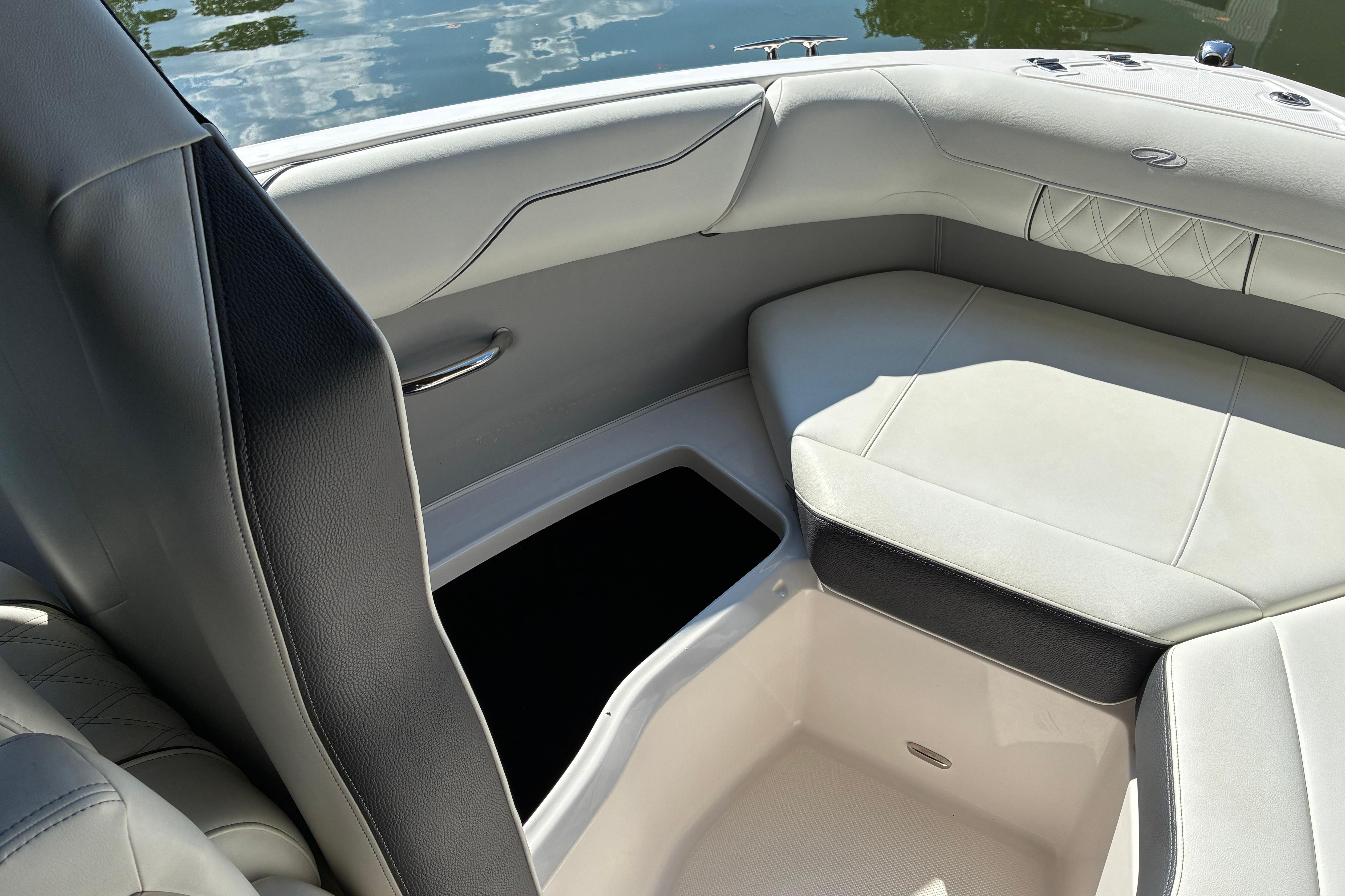 Luxurious interior of 2025 Regal LS2 boat with elegant seating and storage.