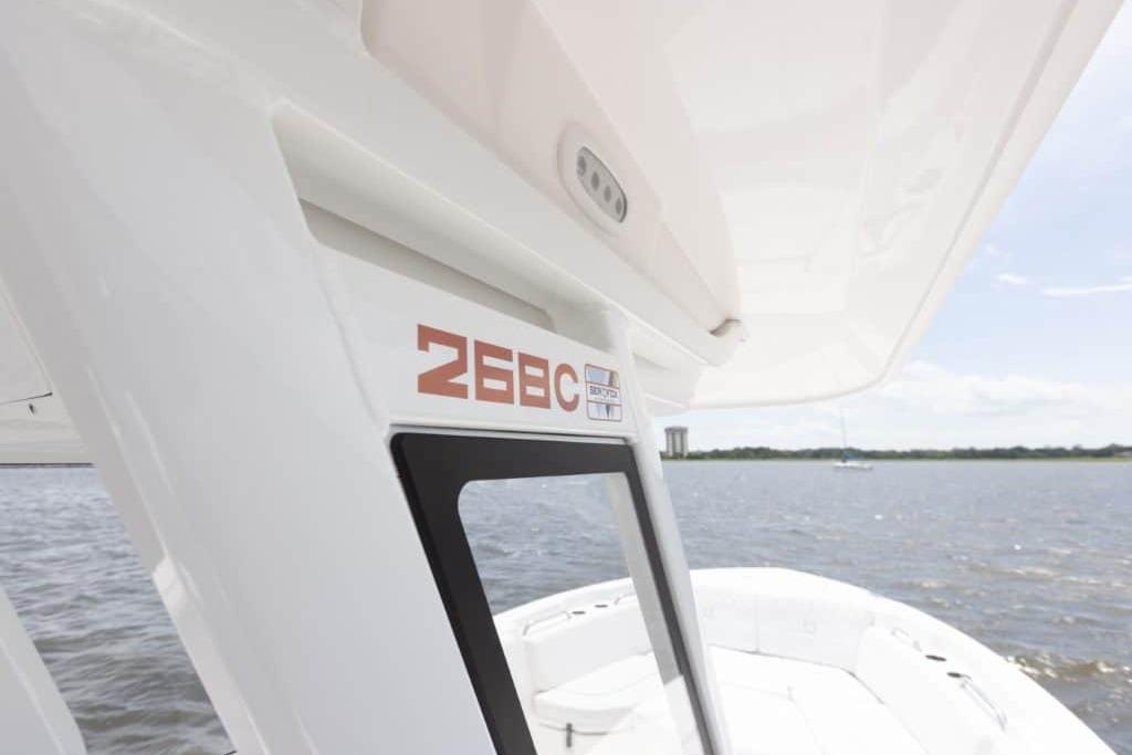 2027 Sea Fox 268 Commander boat on water, showcasing sleek design and branding.
