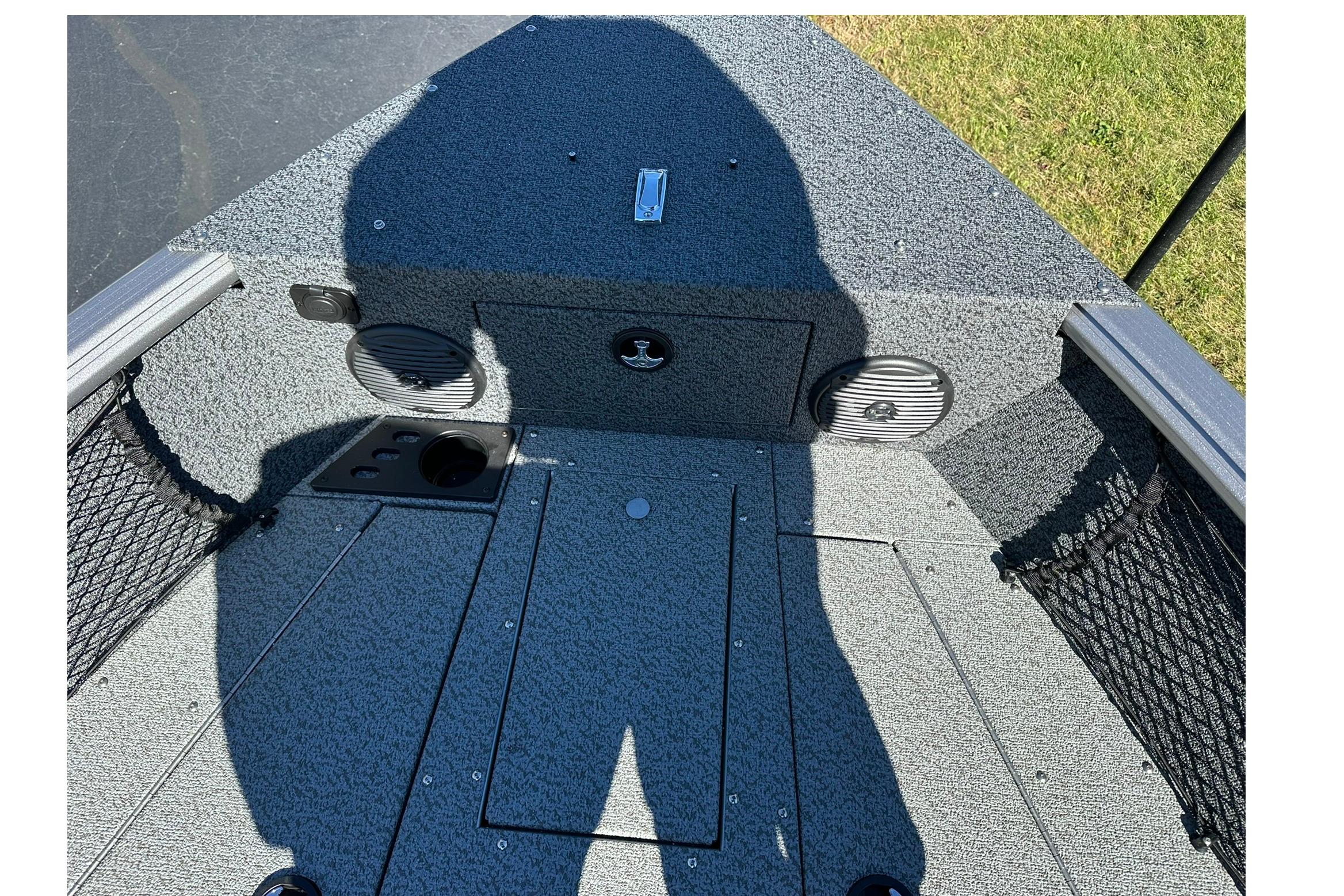 2026 Lund 1875 Impact XS Sport boat interior with shadow and speaker details.