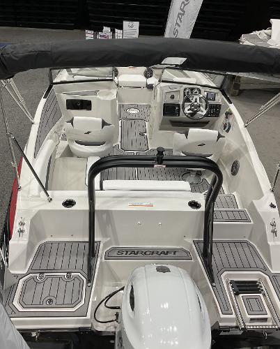 2024 Starcraft SVX 190 OB DC boat interior with seating and control panel.