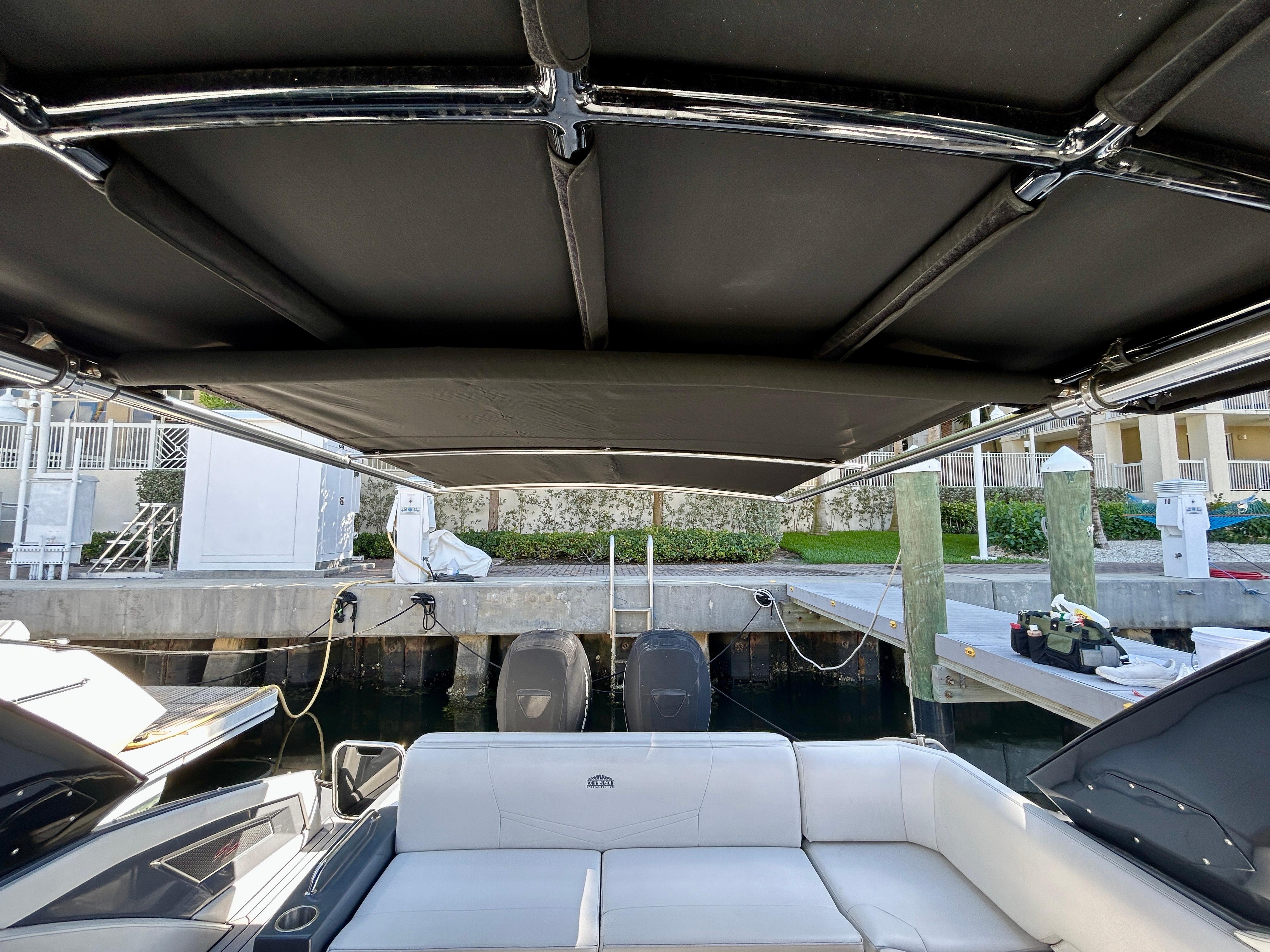 2021 Cruisers Yachts 338 South Beach Edition Bow Rider interior with canopy and seating.