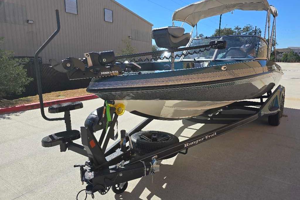 2026 Ranger 212LS boat on trailer with Minn Kota motor, parked outdoors.
