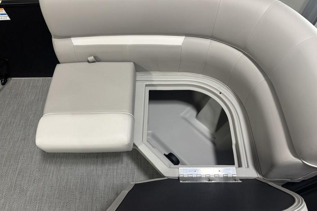 2026 Godfrey Xperience 2086 SFLX boat seat with open storage compartment.