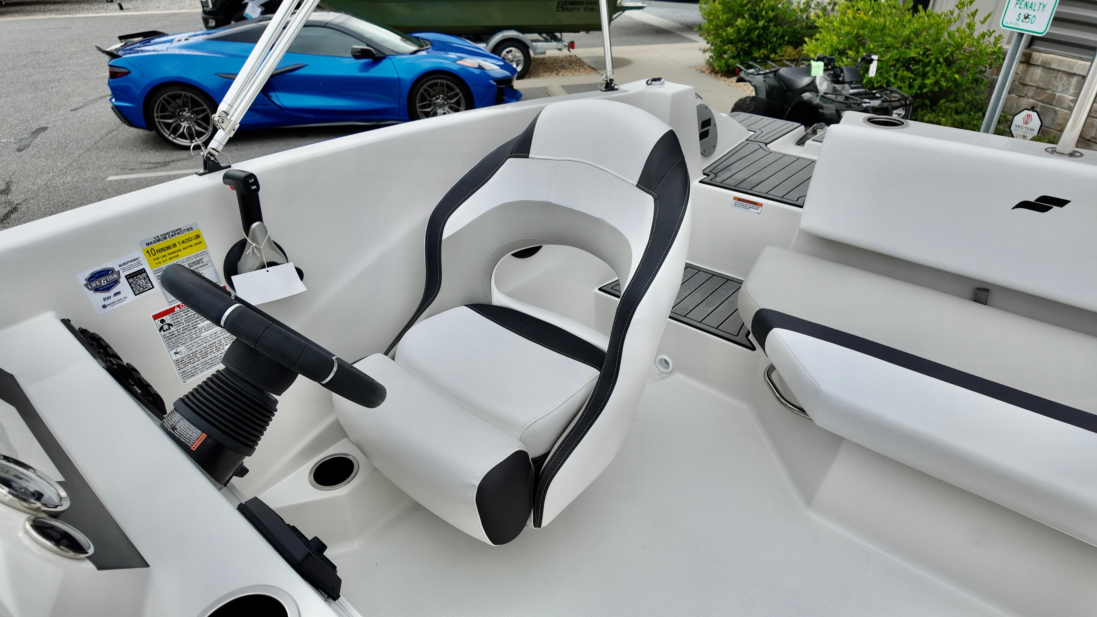 2025 Starcraft SVX 171 OB boat interior with white and black seating.