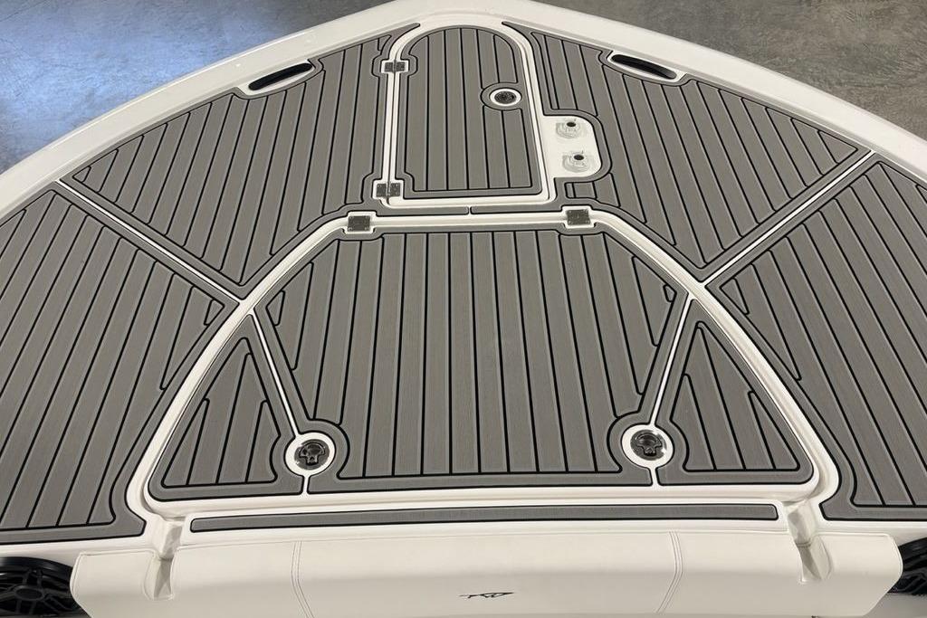 Bow deck of 2026 Tidewater 3100 Carolina Bay boat with gray non-slip surface.