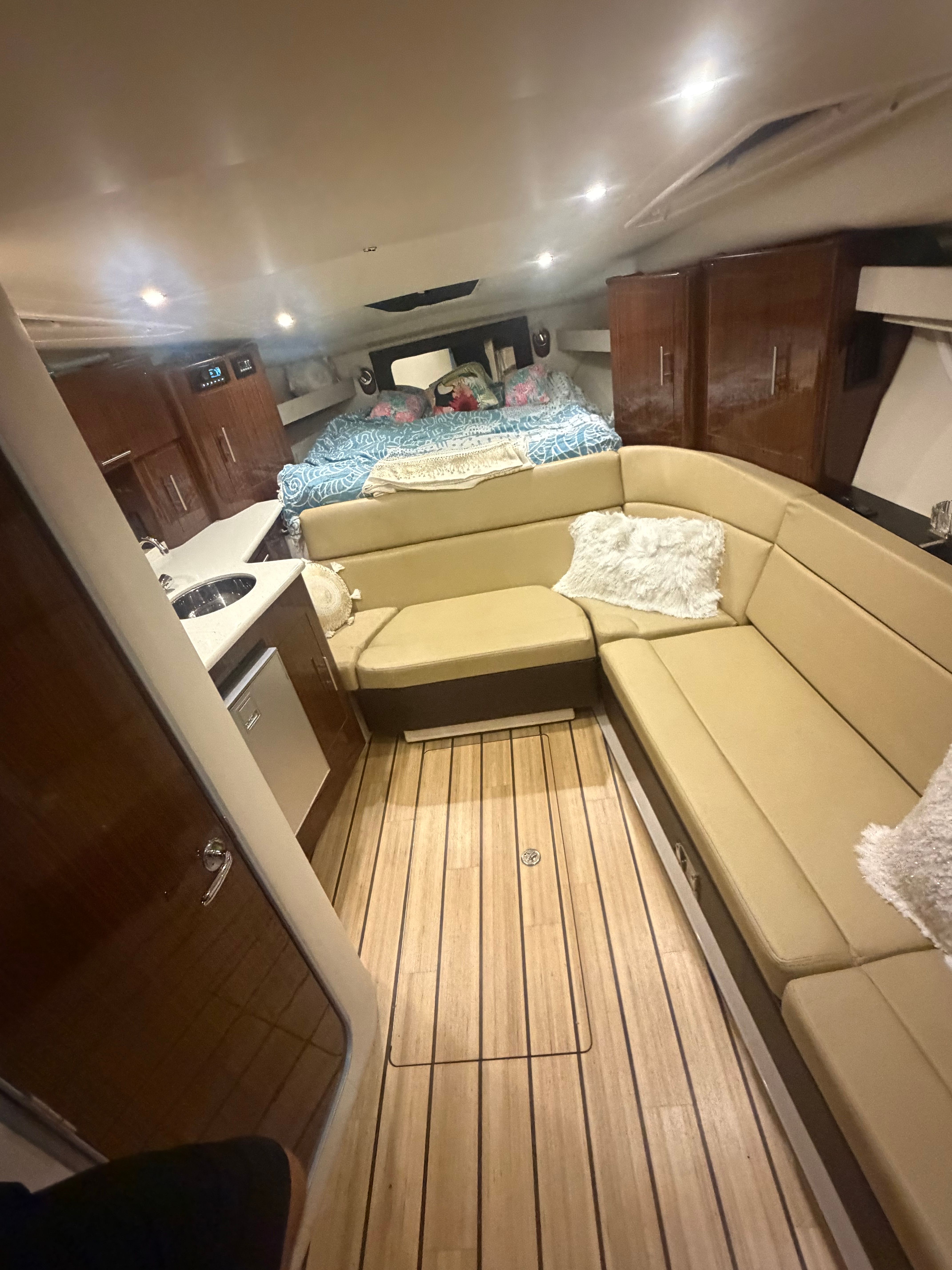 Interior of 2015 Regal 35 Sport Coupe with sofa and bed.