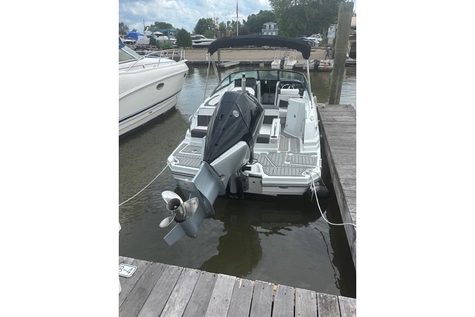 2023 Monterey M-45 boat docked at marina, featuring sleek design and powerful outboard motor.