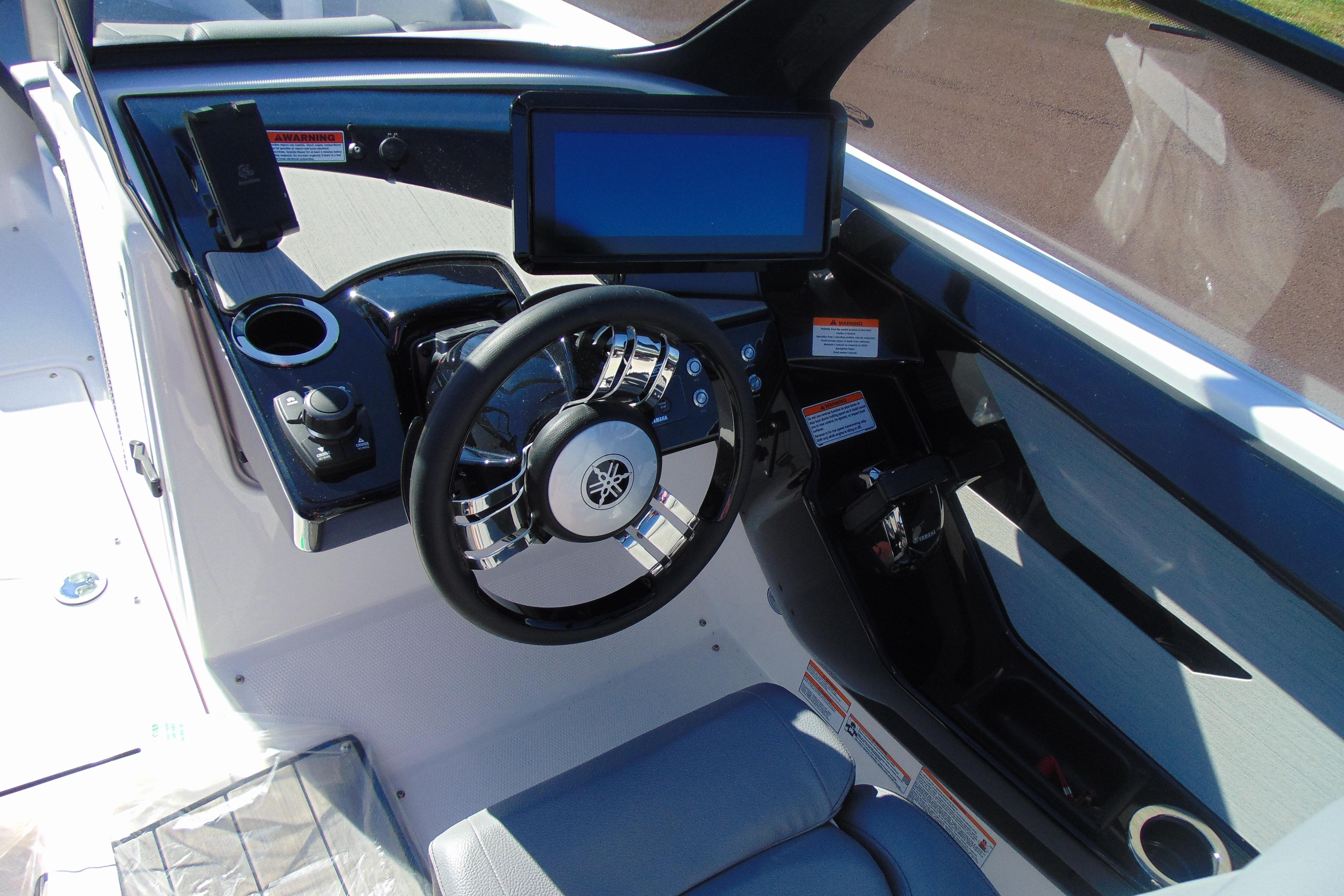 2026 Yamaha Boats 222XD dashboard with steering wheel, touchscreen, and controls.