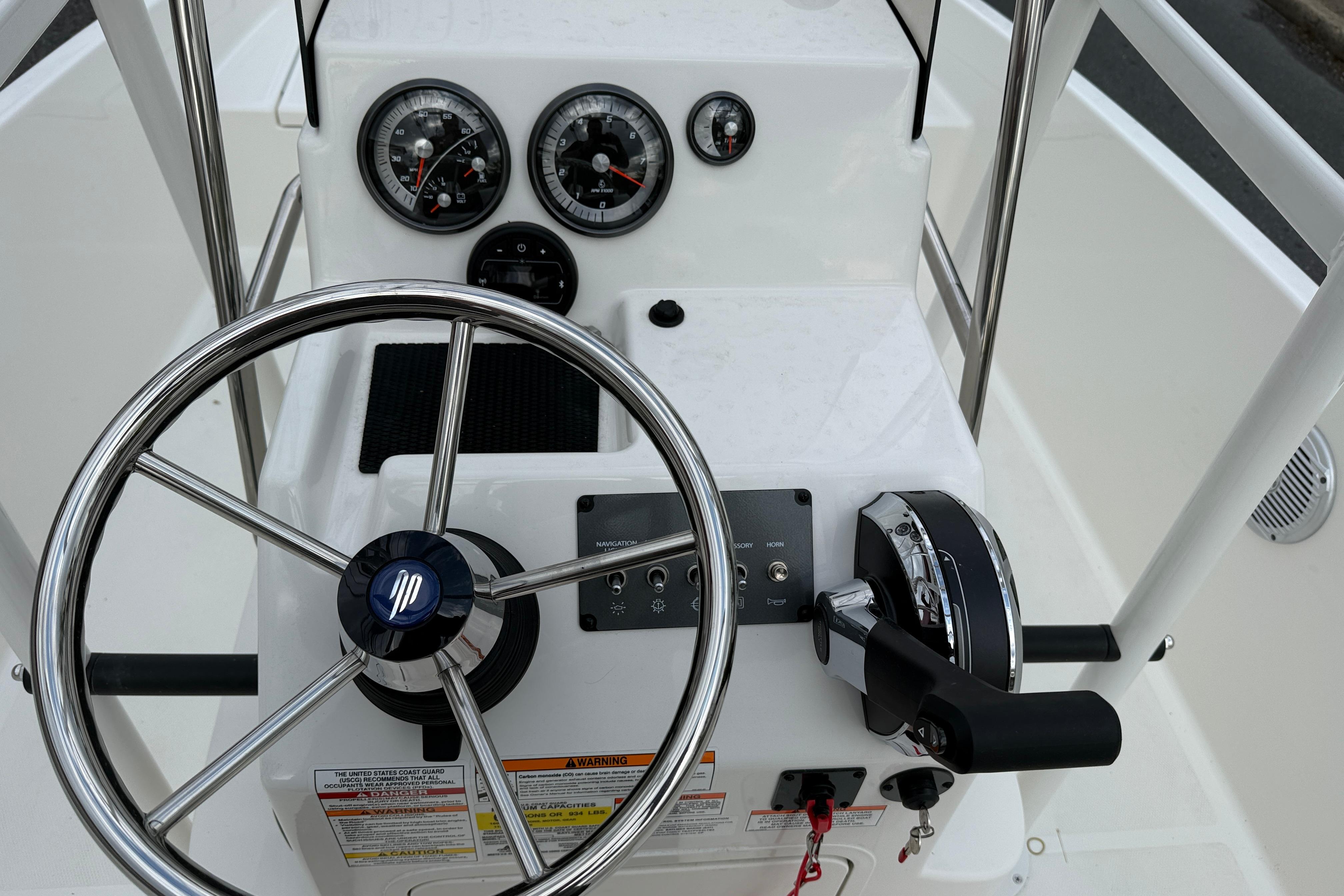 Steering console of 2026 Bayliner Trophy T18 boat with gauges and controls.