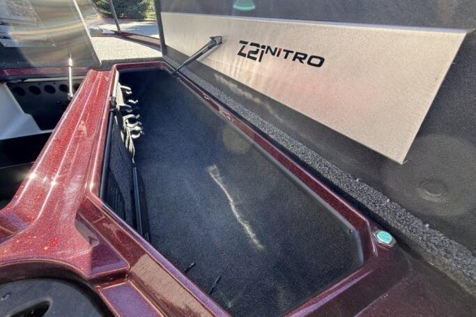 2026 Nitro Z21 XL Pro boat storage compartment with open lid, showcasing interior space.
