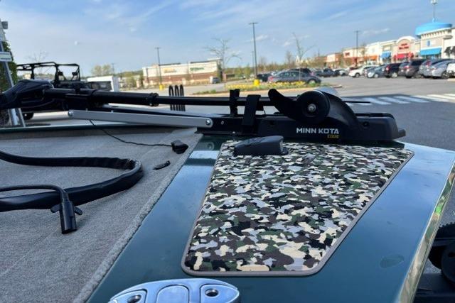 2026 Tracker Bass Tracker Classic Limited boat with Minn Kota trolling motor in a parking lot.