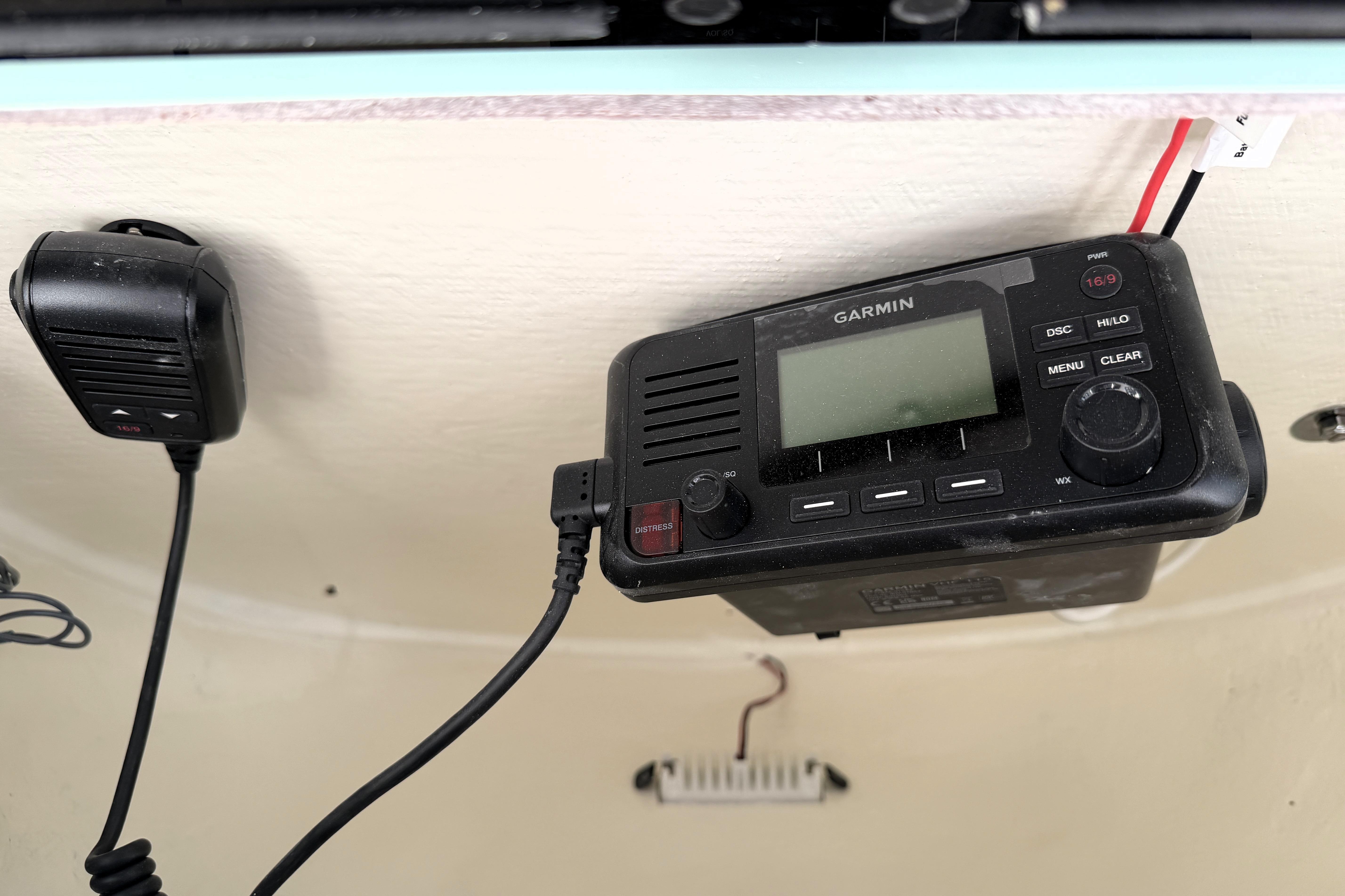 Garmin marine radio and microphone on 2025 Key West 239 FS boat dashboard.