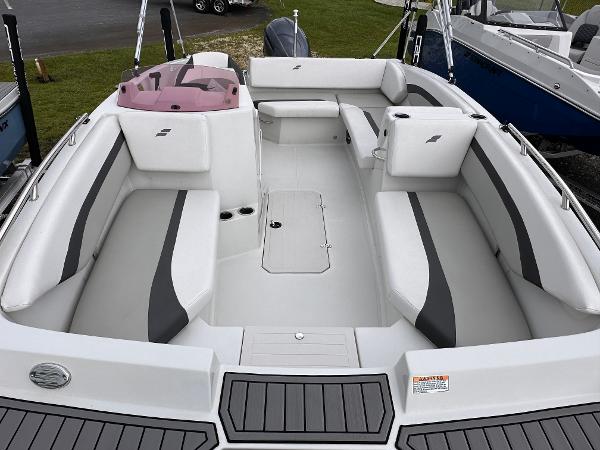 2024 Starcraft 171 SVX boat interior with white and gray seating, spacious layout.
