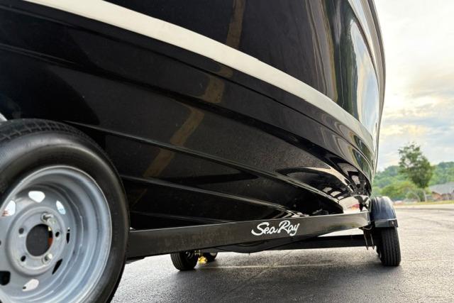 2017 Searay SPX210 boat on trailer, showcasing sleek black hull design.