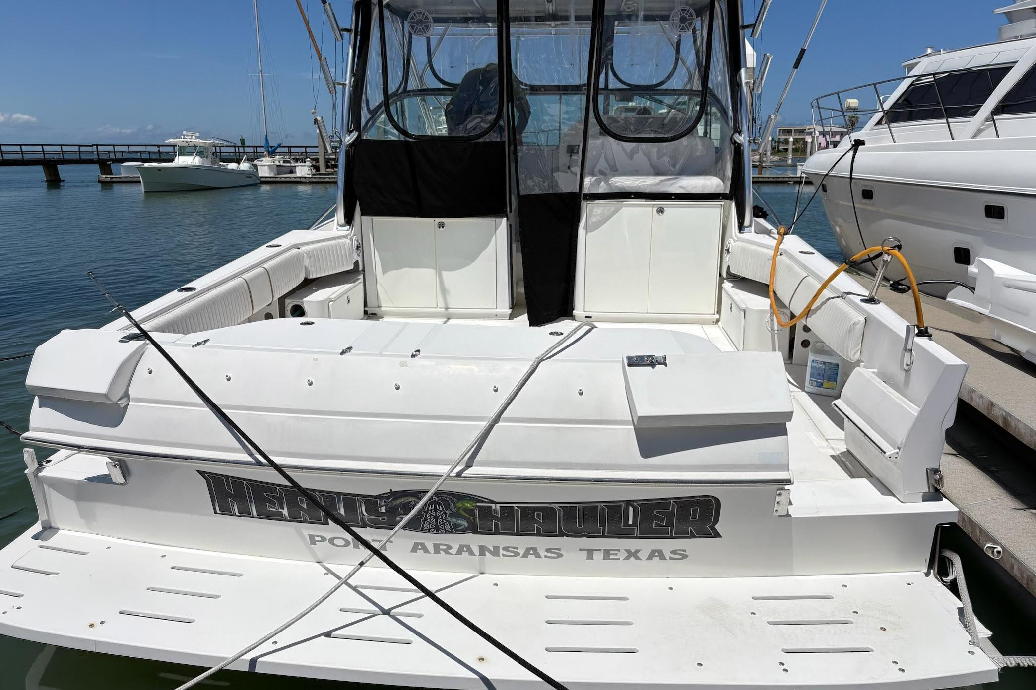 2008 Stamas 370 Express boat docked in Port Aransas, Texas marina.