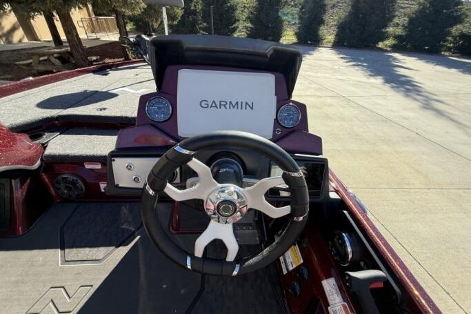 2026 Nitro Z21 XL Pro boat dashboard with Garmin navigation system and steering wheel.