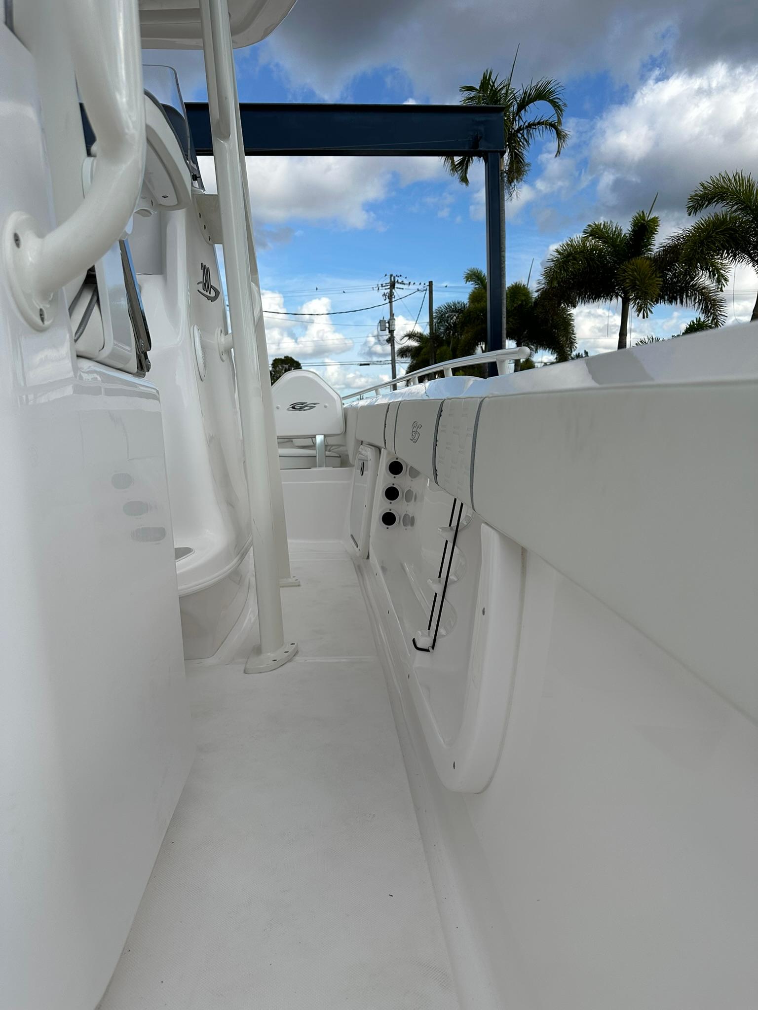 2025 Glasstream 28 Pro boat deck with palm trees and cloudy sky background.