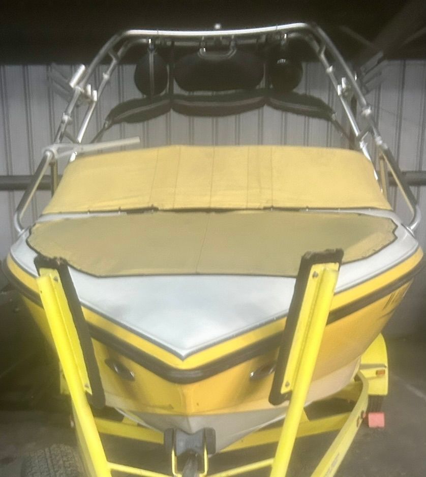 2003 Centurion Avalanche boat on trailer in storage facility.