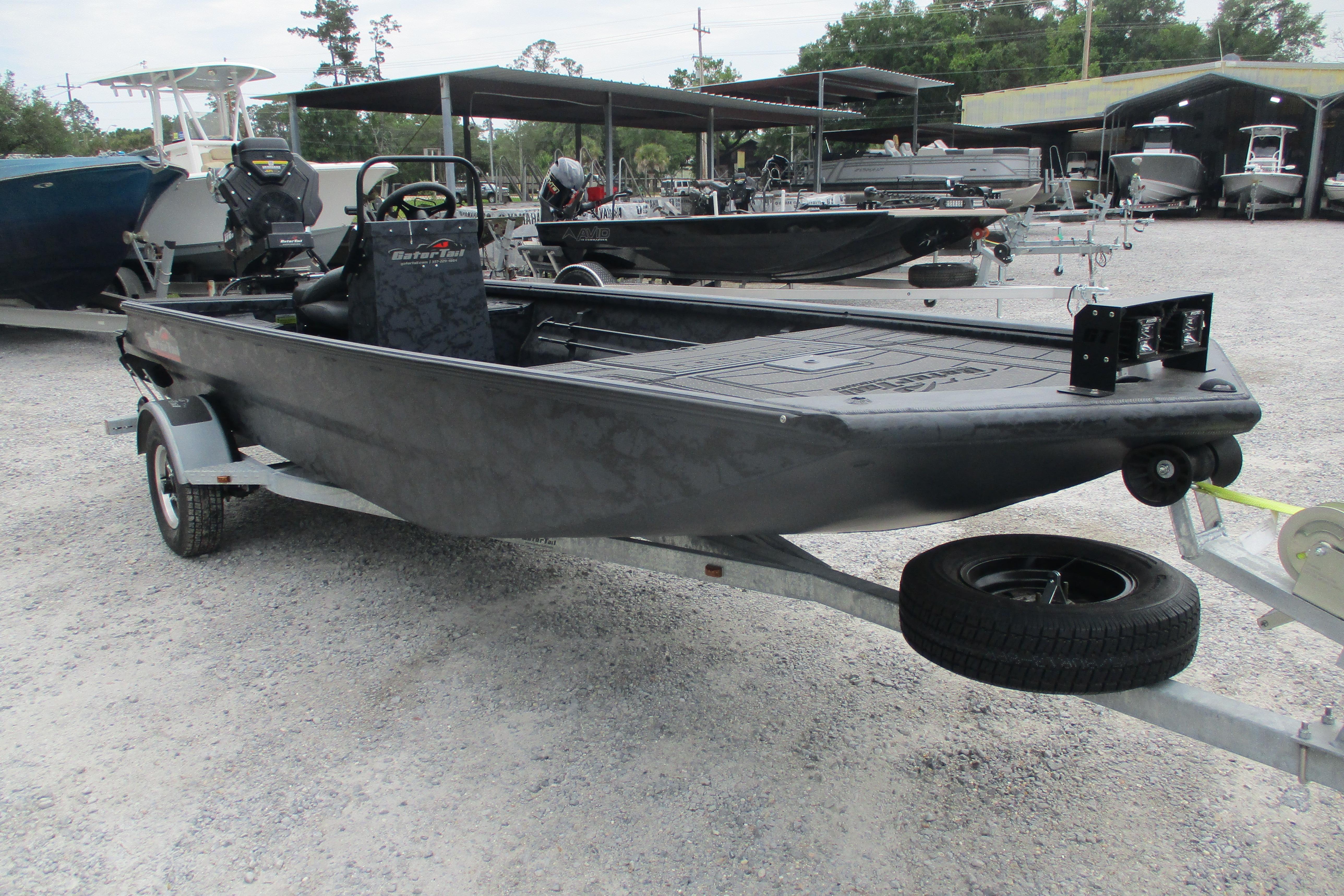 2026 Gator Tail 1860 Extreme CC boat on trailer in outdoor showroom.