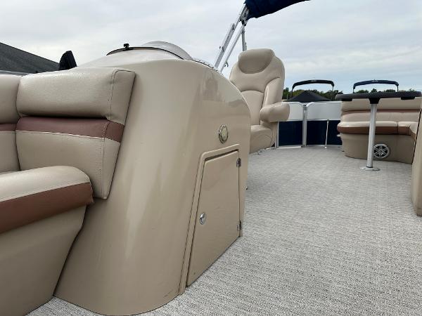 The image shows the interior of a 2018 South Bay S224CR pontoon boat with beige seating.