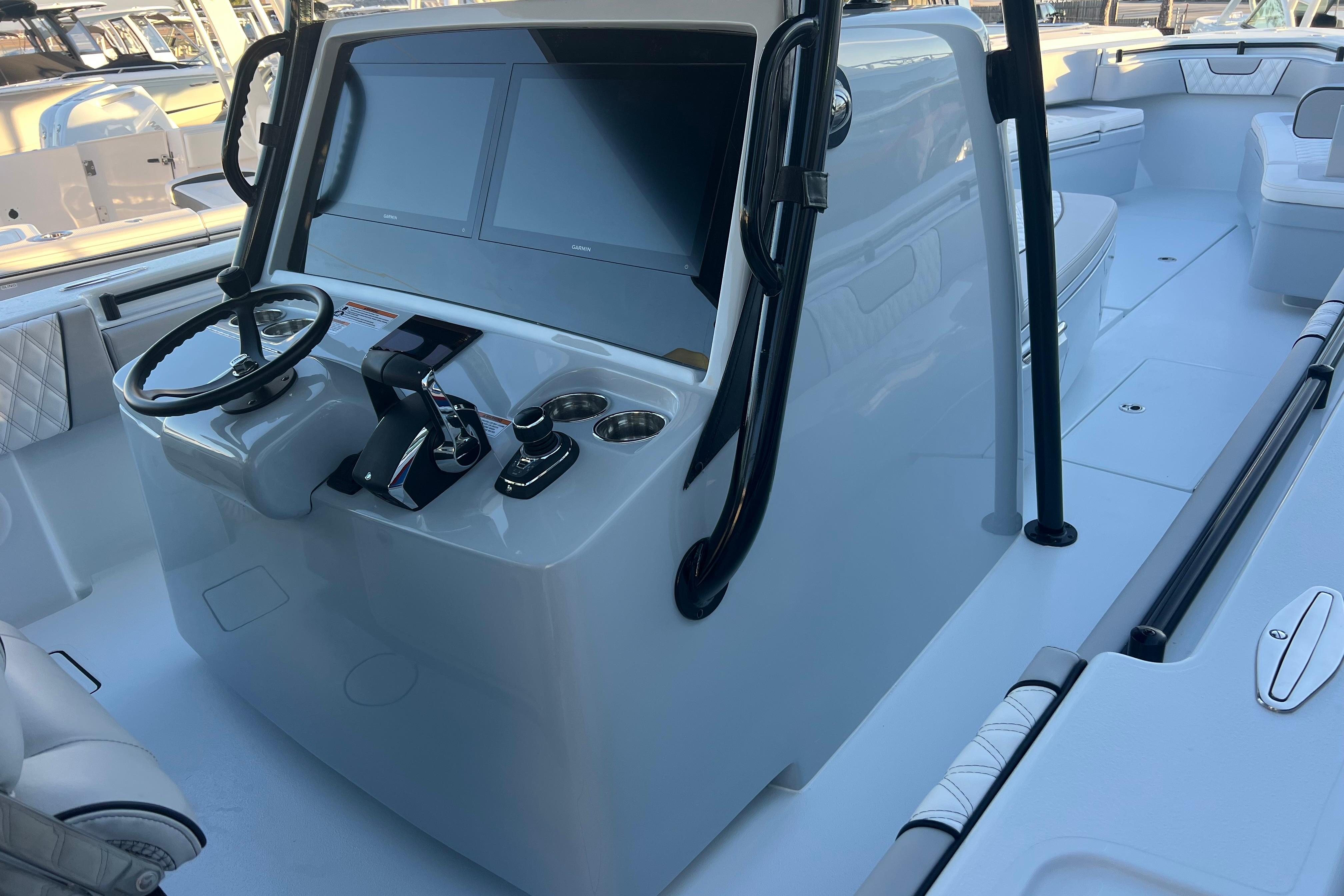 2026 Contender 39 ST boat cockpit with modern steering and dual screens.
