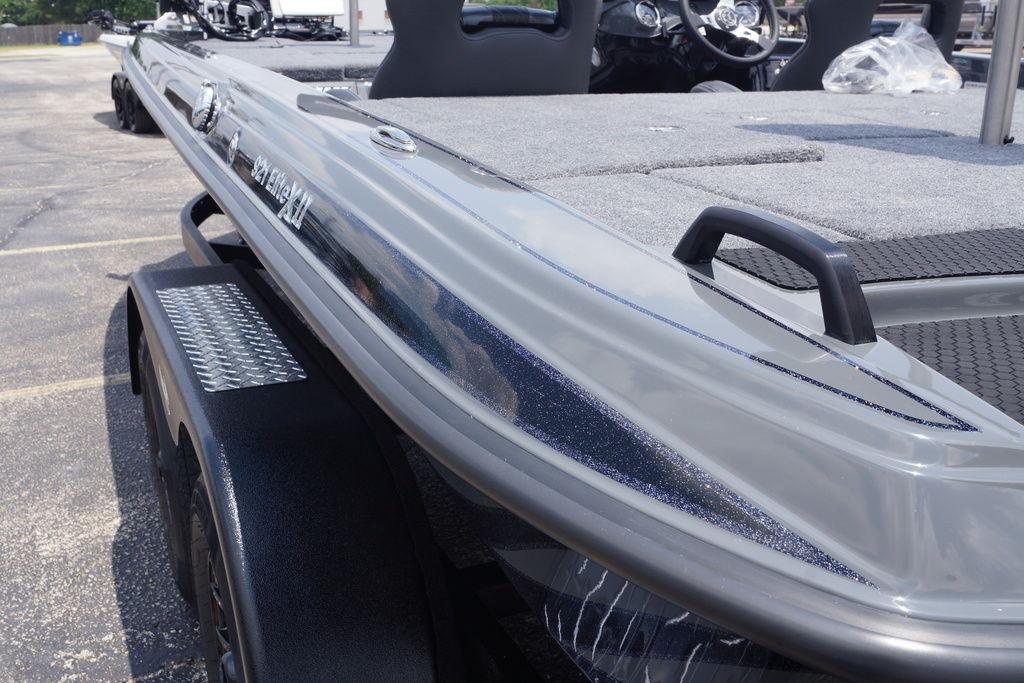 2027 Phoenix 921 Elite X II boat, sleek design, parked on trailer.
