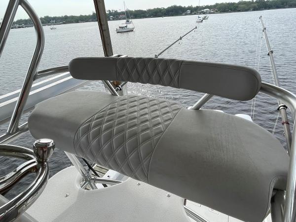 2020 Front Runner 39 Center Console boat seat with diamond-stitched upholstery, overlooking calm waters.