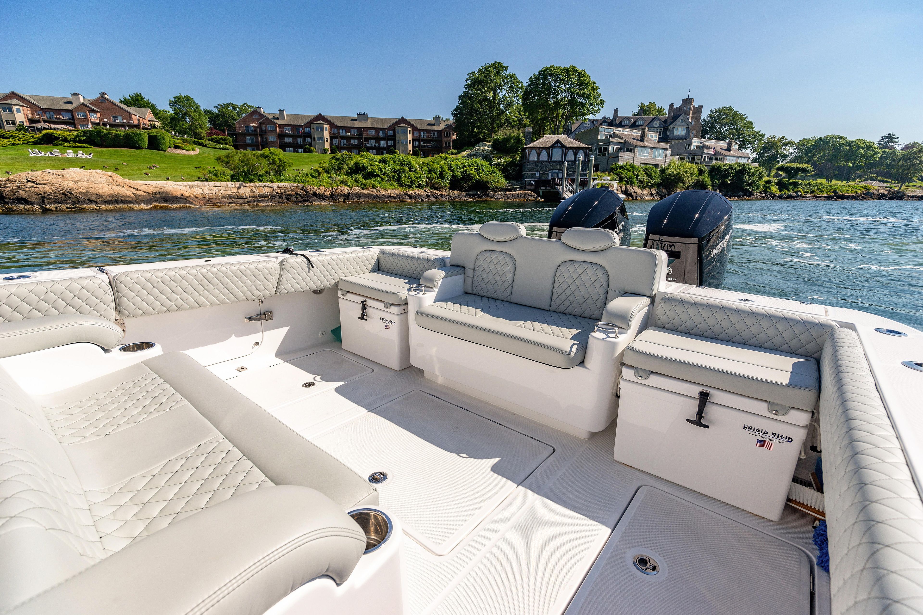 2024 HCB 39 Speciale boat interior with luxurious seating and scenic waterfront view.