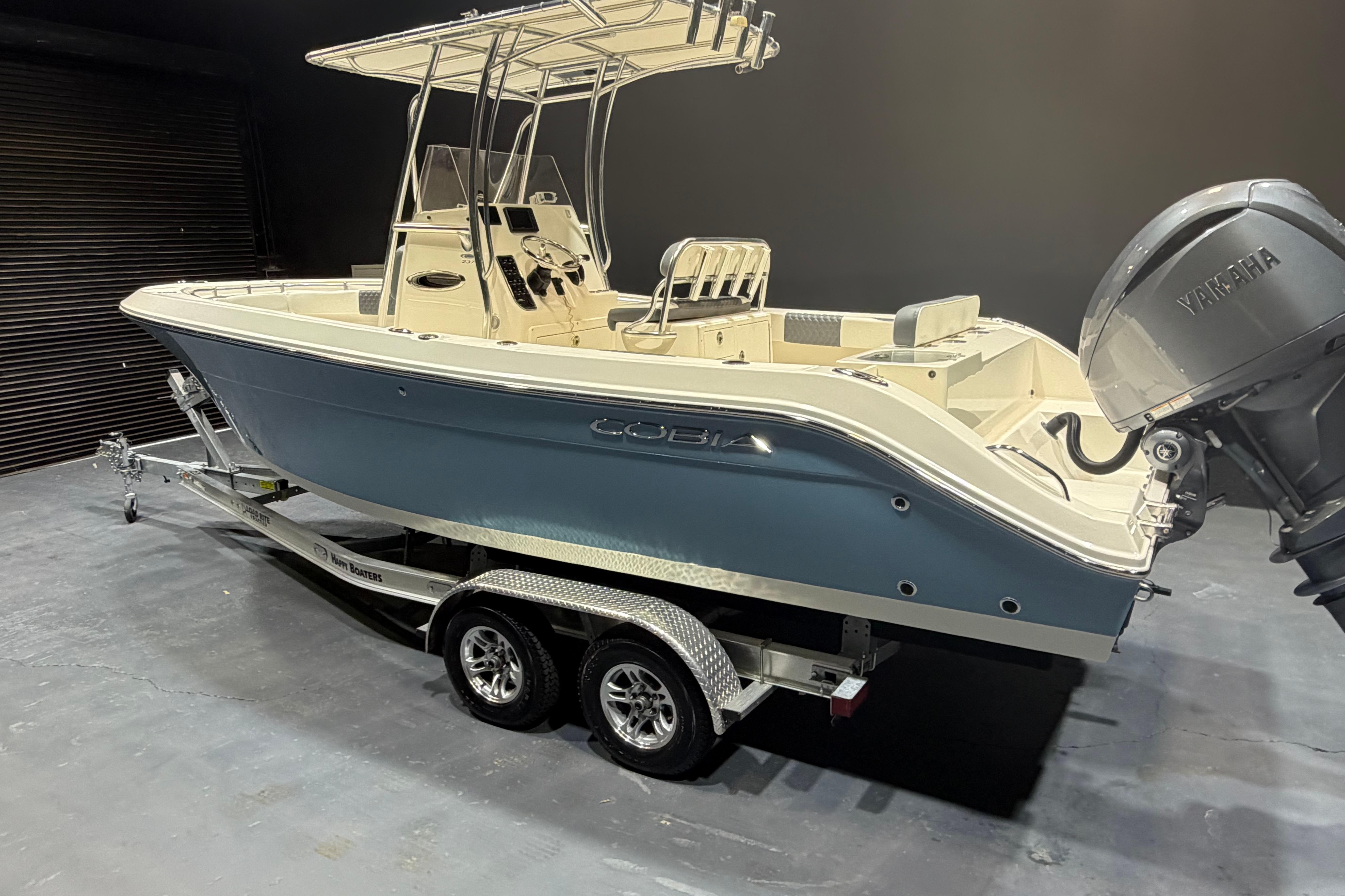 2023 Cobia 237 Center Console boat on trailer with Yamaha outboard motor.